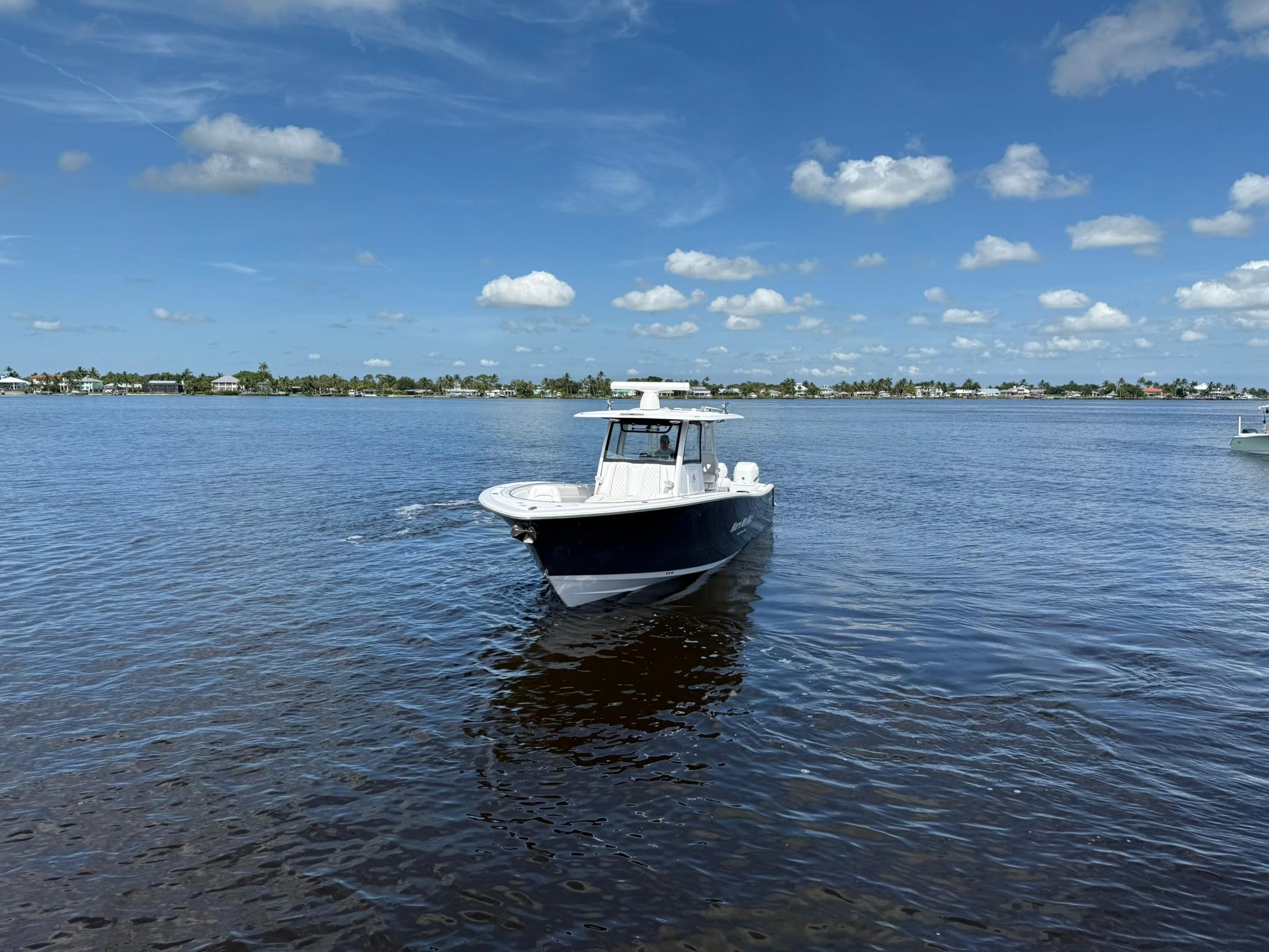 Sportsman-Open 352 Center Console 2021-Here We Go FL-US-2021 Sportsman Open 352 Center Console boat on calm water under blue sky.-9850725 | Thumbnail