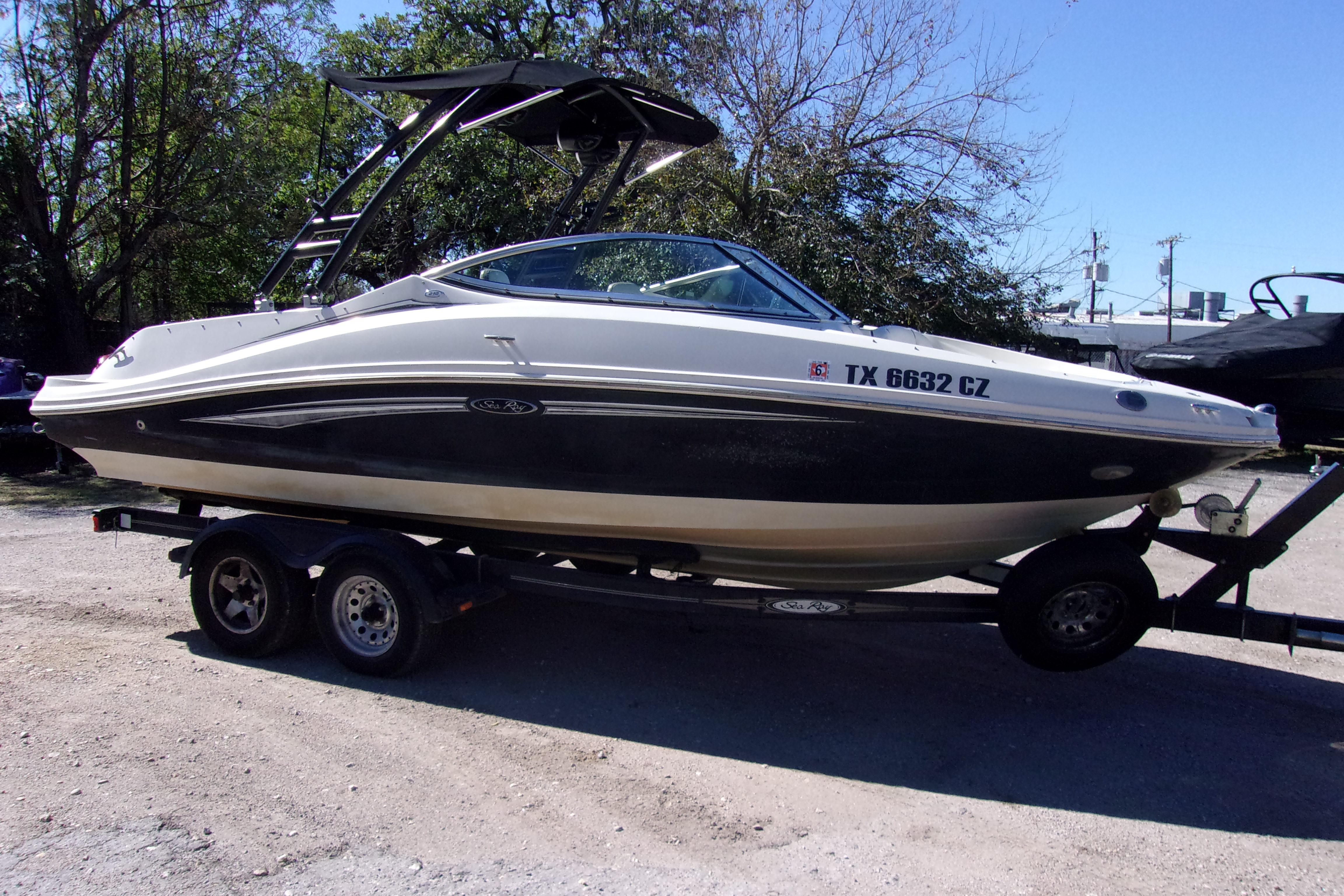 2007 Sea Ray 210 Select boat on trailer, parked outdoors.