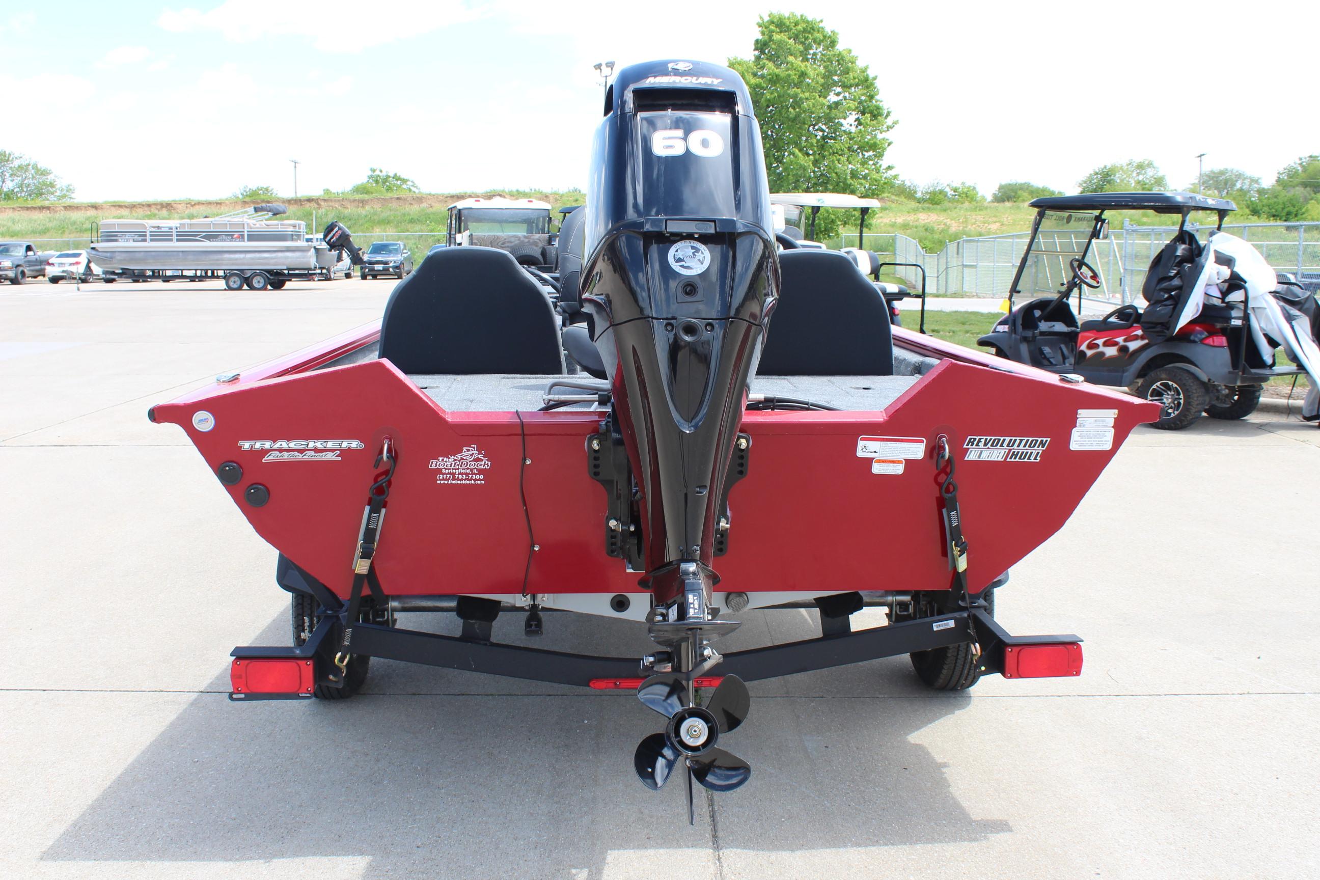 2025 Tracker Pro Team 175 boat, rear view, red color, parked outdoors.