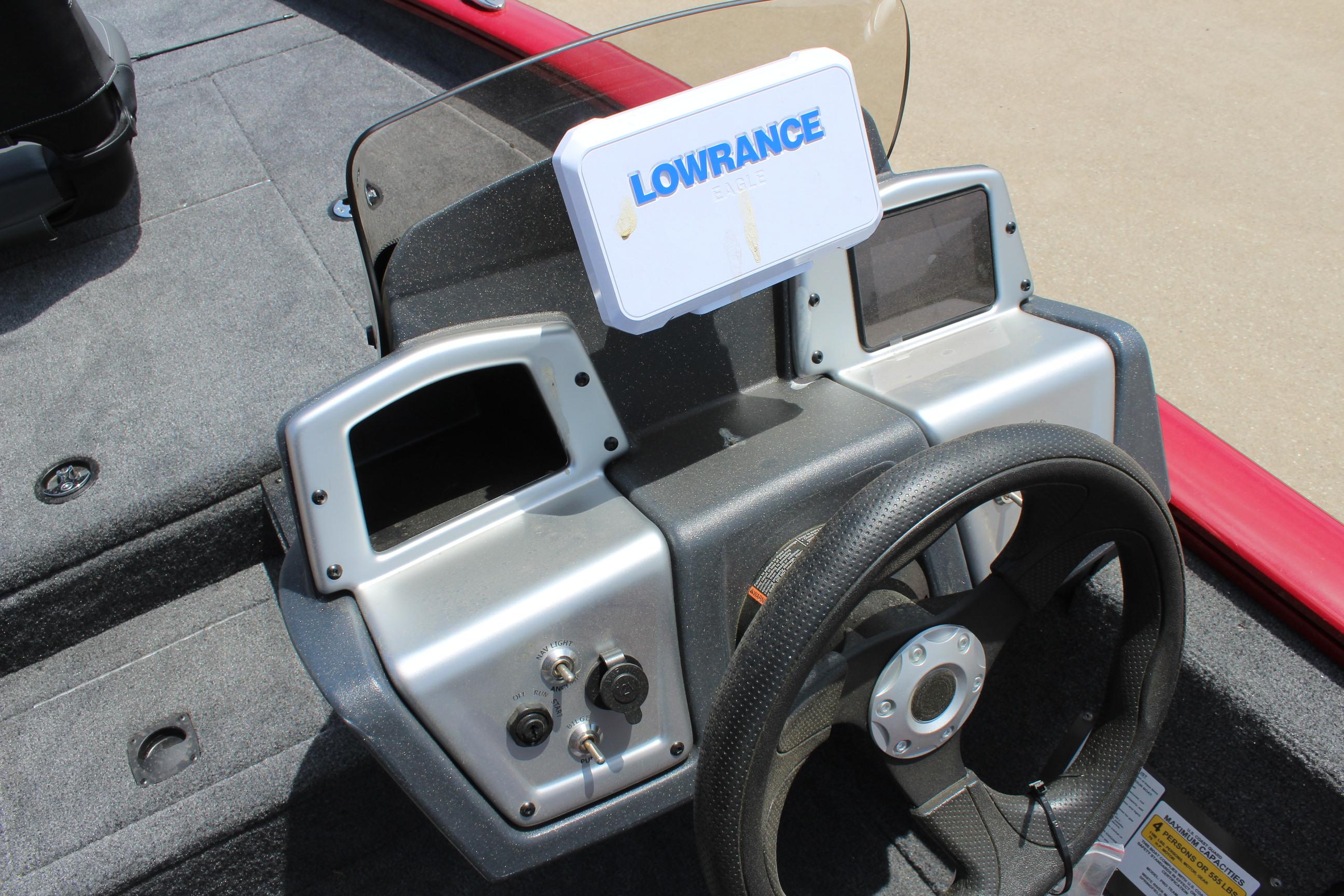 2025 Tracker Pro Team 175 boat dashboard with Lowrance electronics and steering wheel.