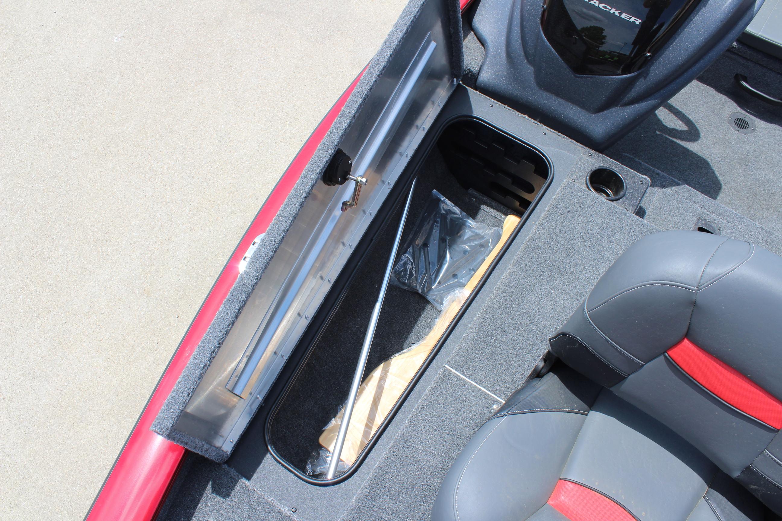 2025 Tracker Pro Team 175 boat interior with open storage compartment and seating.