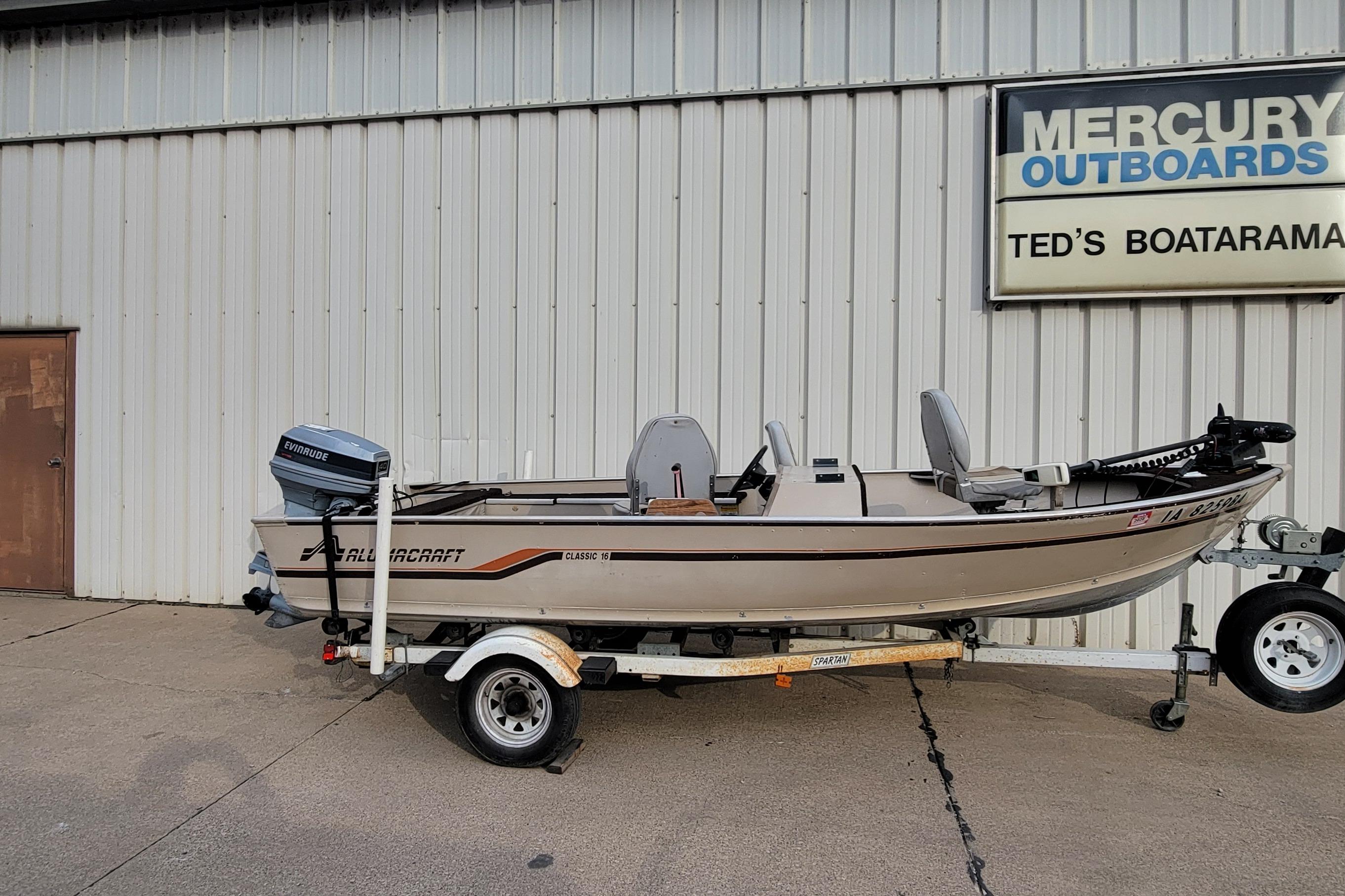 1987 Alumacraft Classic 165 CS boat on trailer outside Ted's Boatarama.