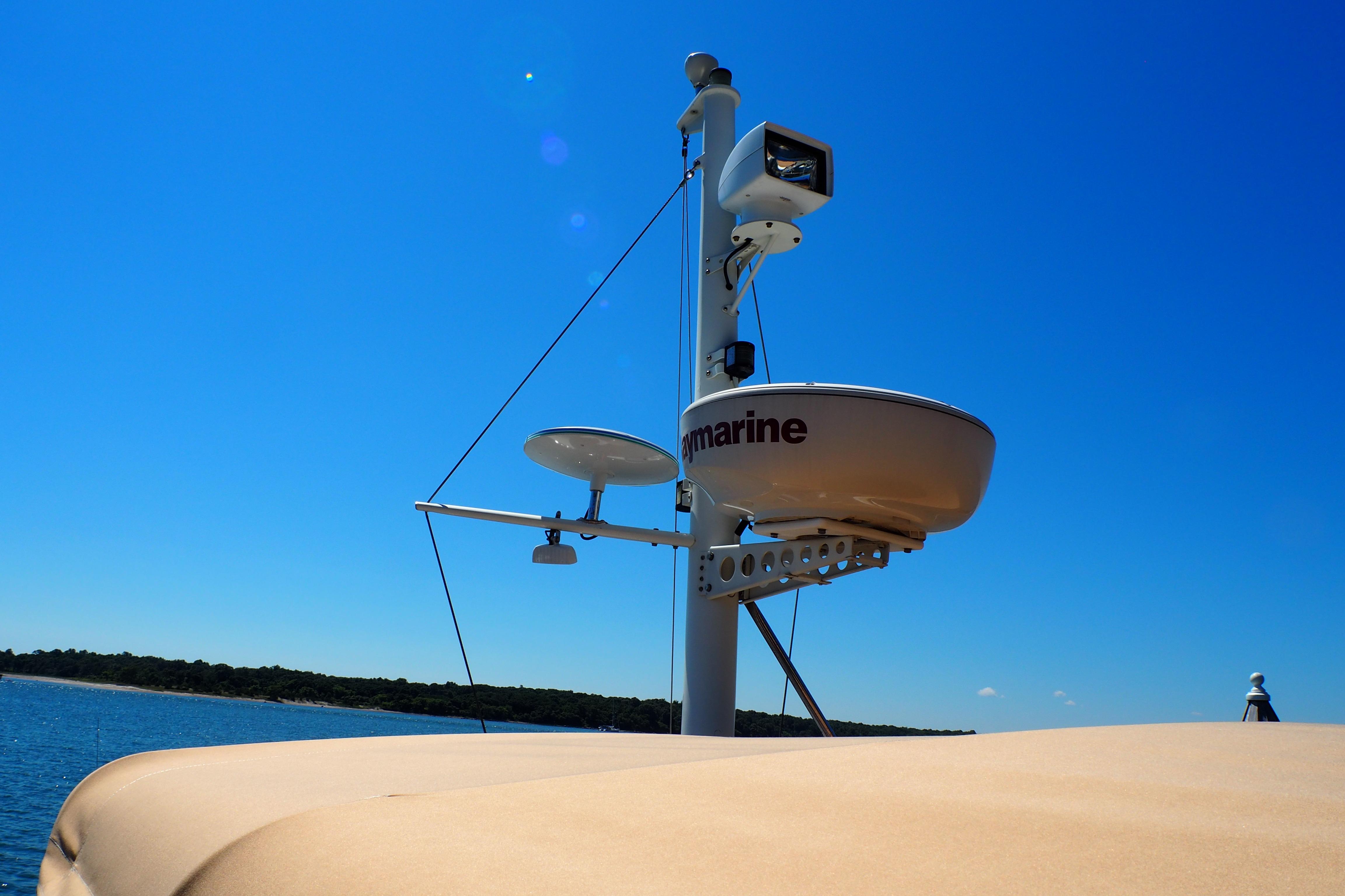 Radar equipment on 1995 Grand Banks 38 Eastbay EX against clear blue sky.