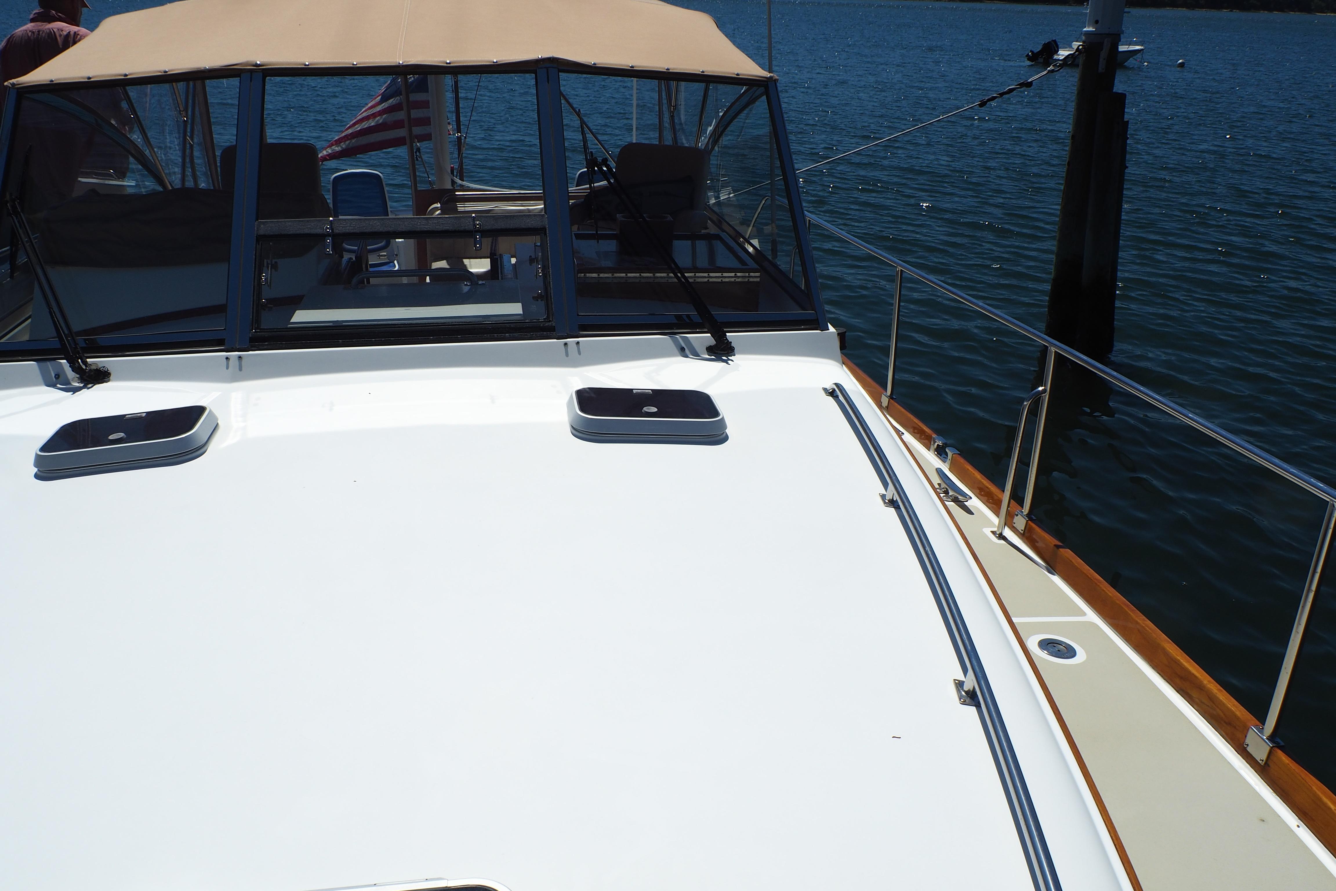 1995 Grand Banks 38 Eastbay EX yacht deck with water view.