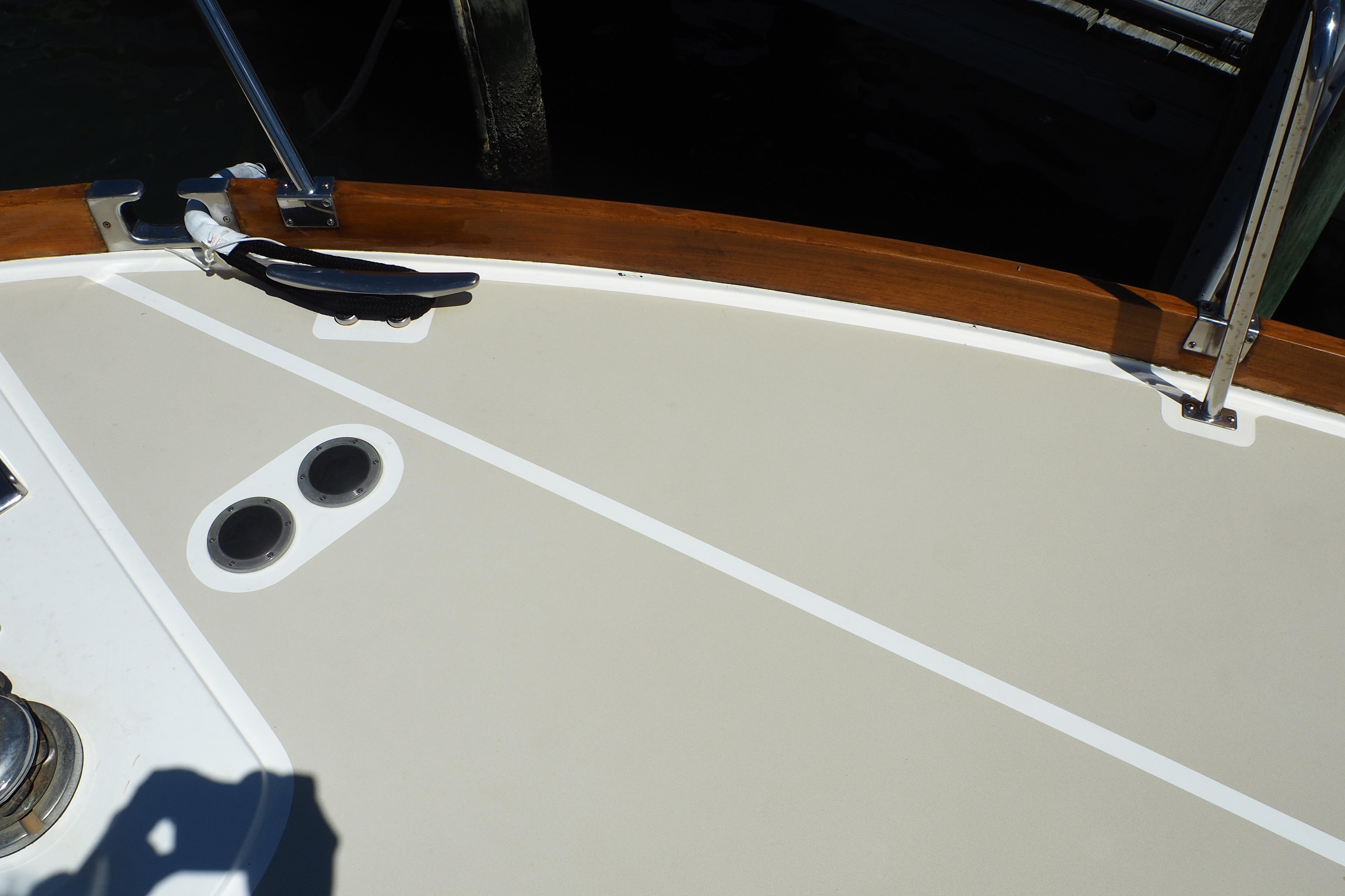 Deck of 1995 Grand Banks 38 Eastbay EX with cleat and railing.