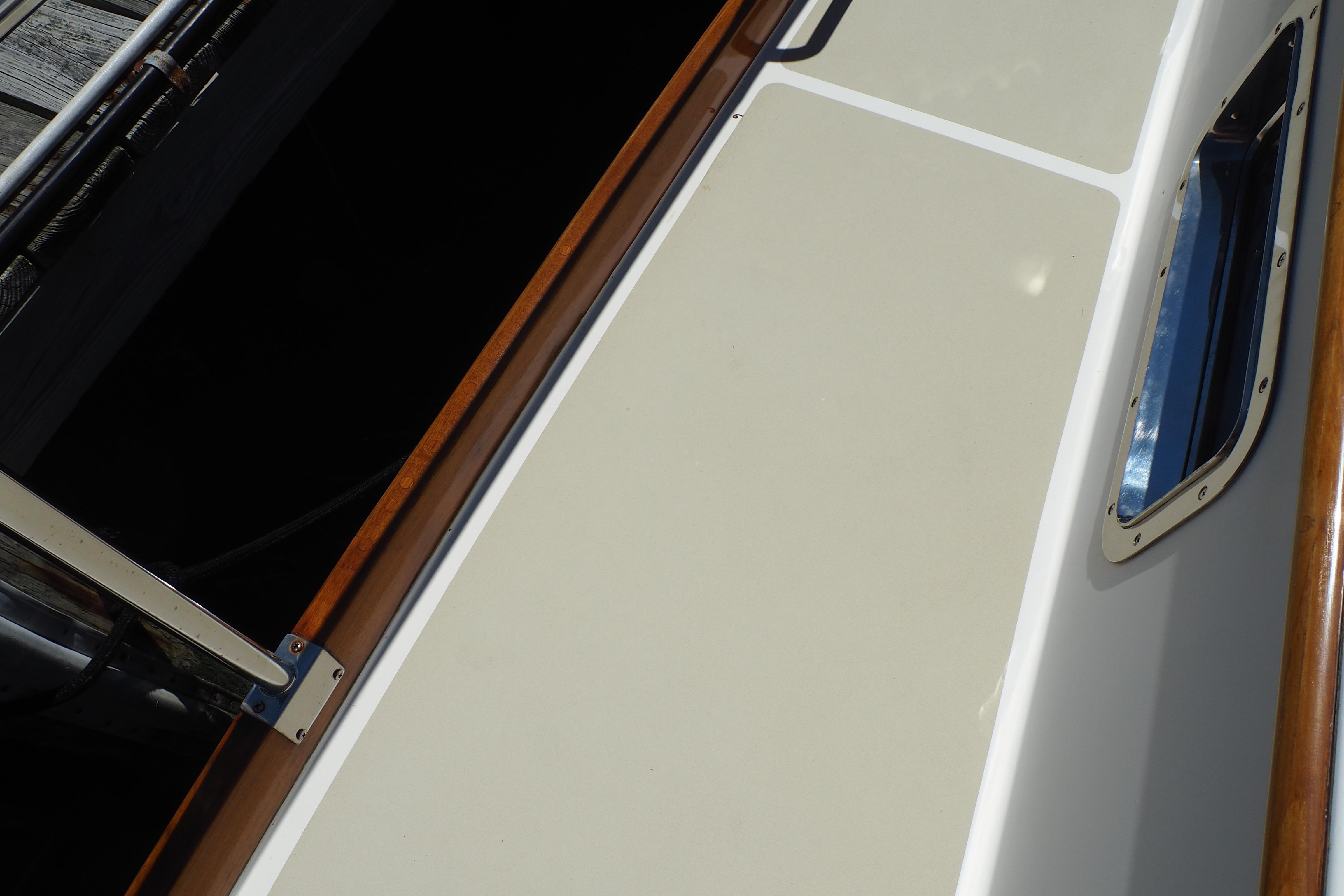 1995 Grand Banks 38 Eastbay EX boat deck with wood trim and window detail.