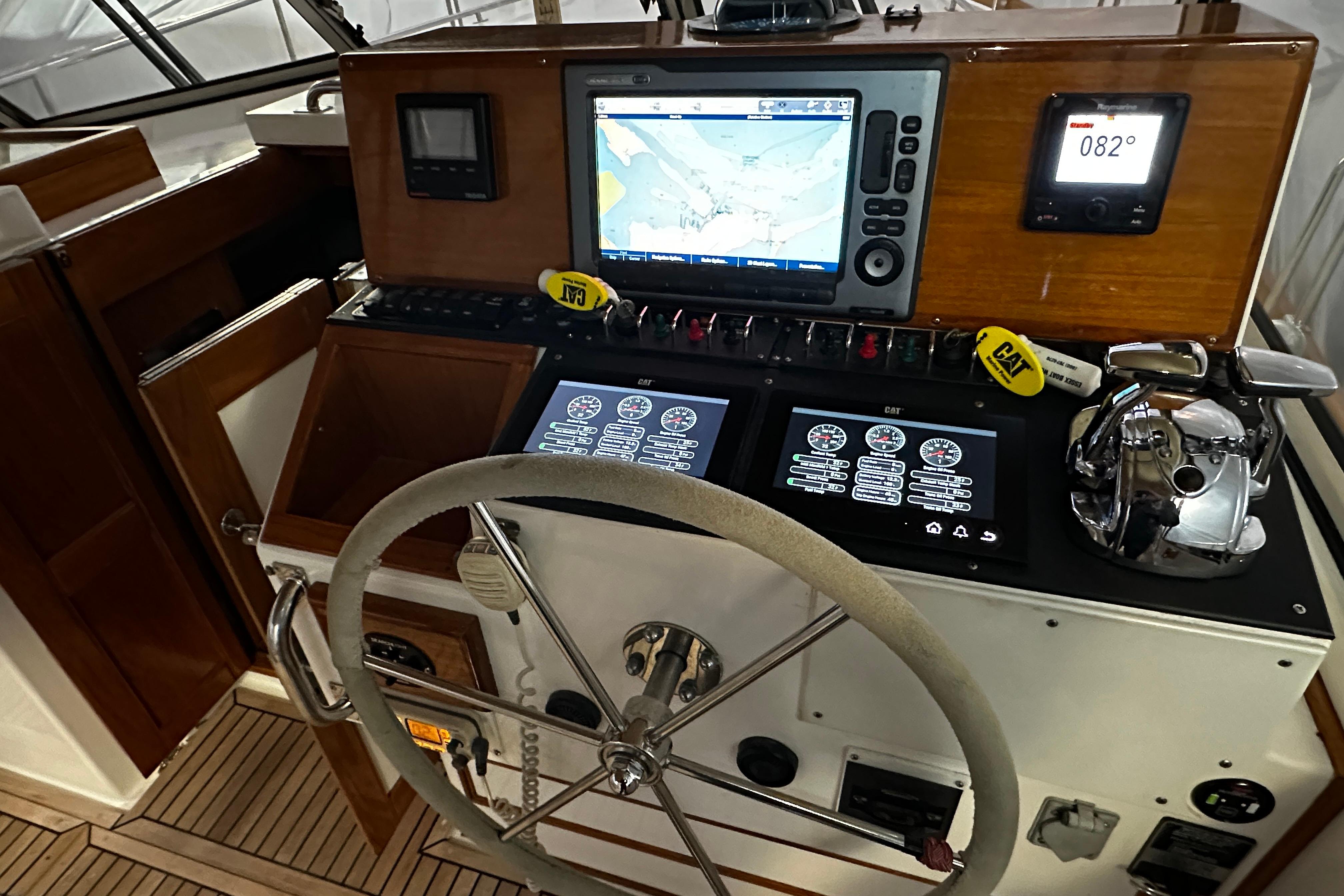 Helm of 1995 Grand Banks 38 Eastbay EX with navigation and control systems.