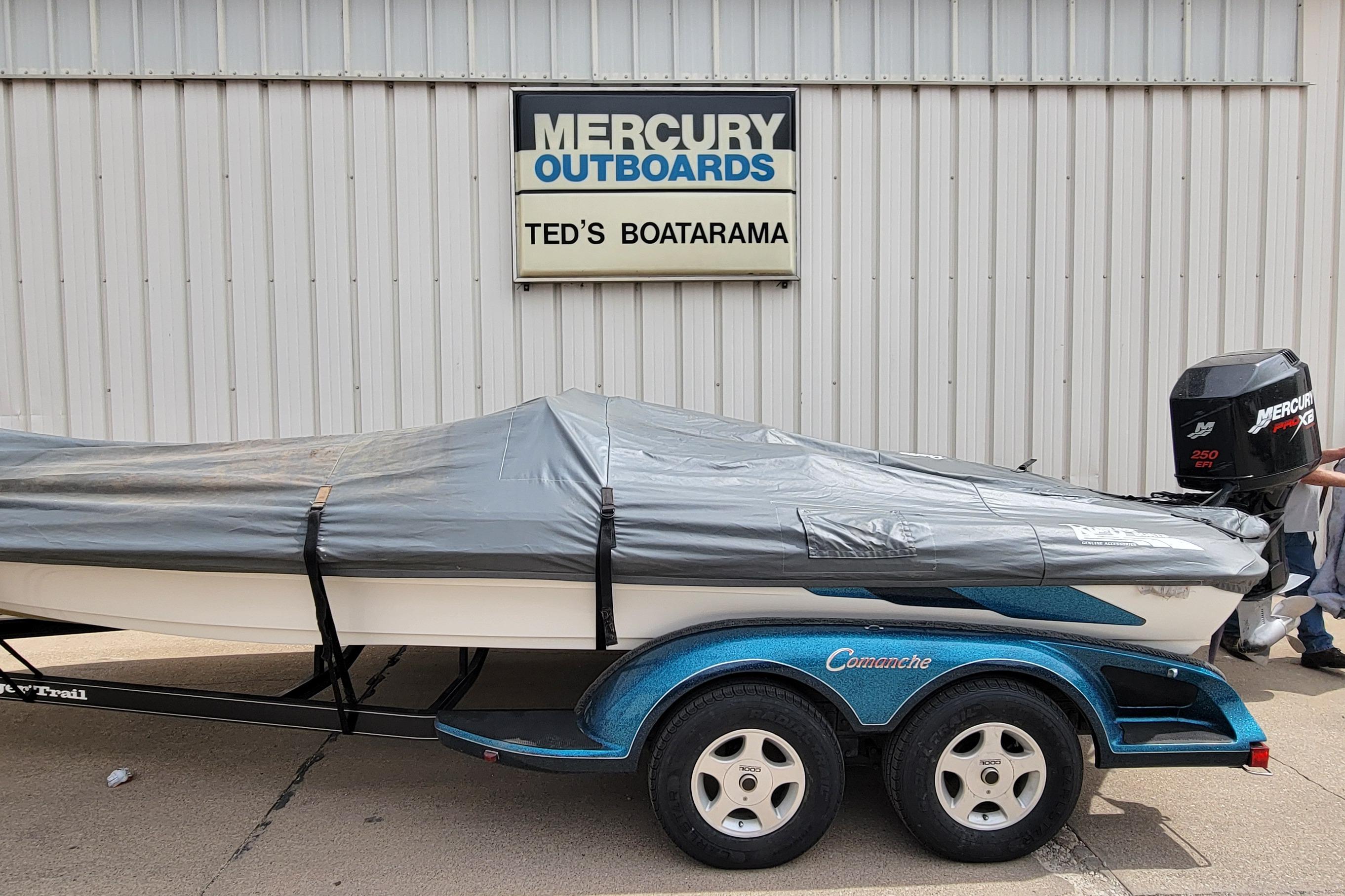 2000 Ranger 522DVX Comanche boat with cover at Ted's Boatarama, Mercury outboard engine.