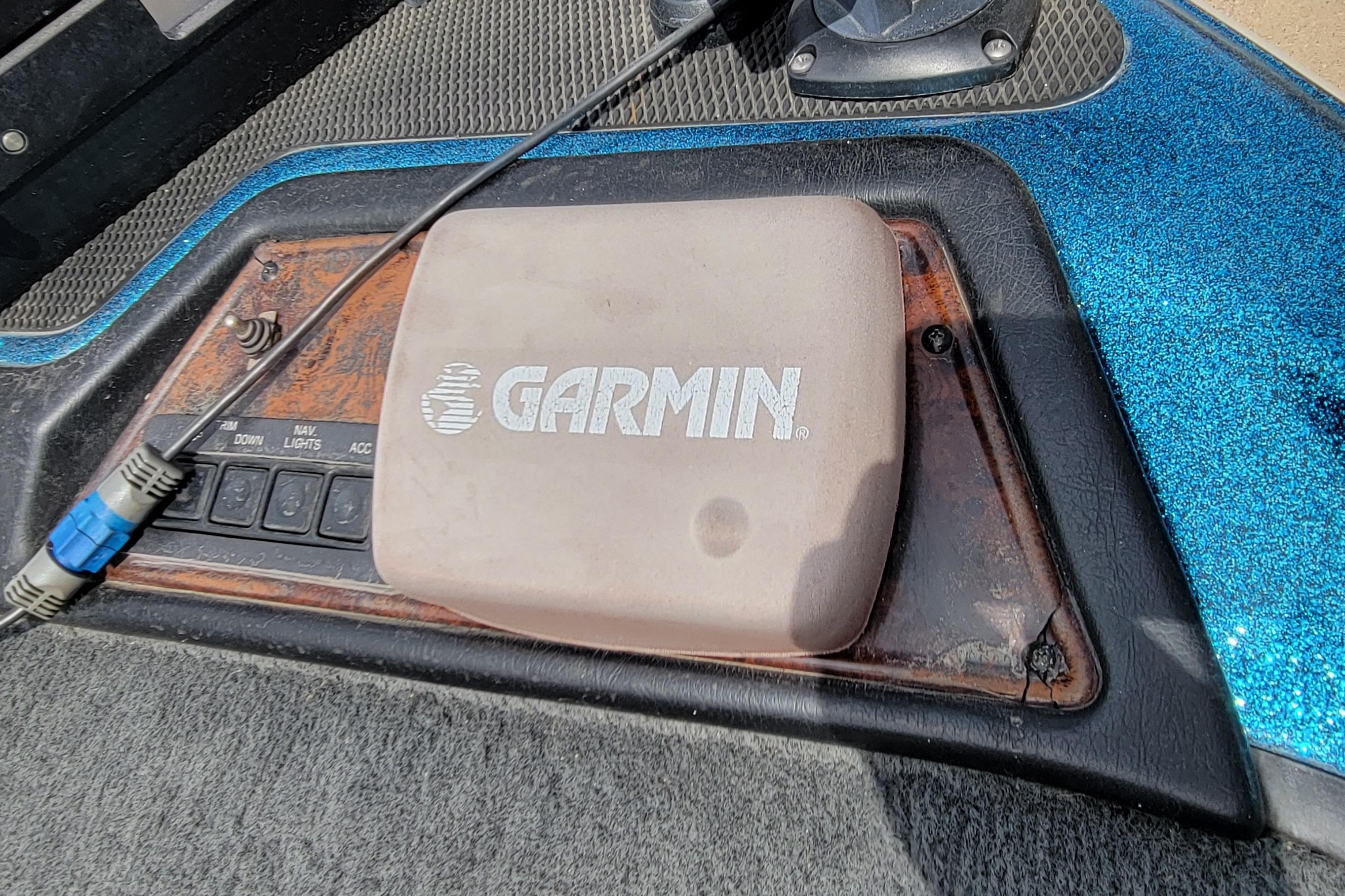 Garmin device on 2000 Ranger 522DVX Comanche boat dashboard with control switches.