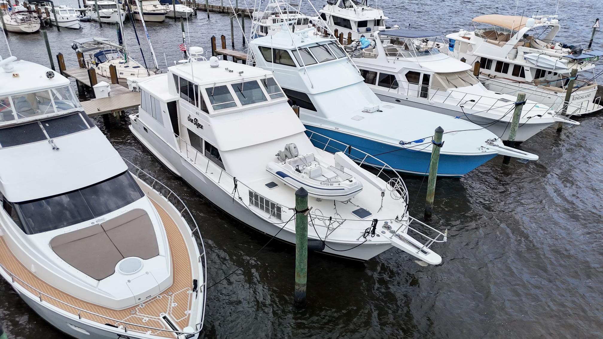 Viking-60 Cockpit Sport Yacht 1996-Sea Tiger FL-US-Docked yachts including a 1996 Viking 60 Cockpit Sport Yacht at a marina.-9787053 | Thumbnail