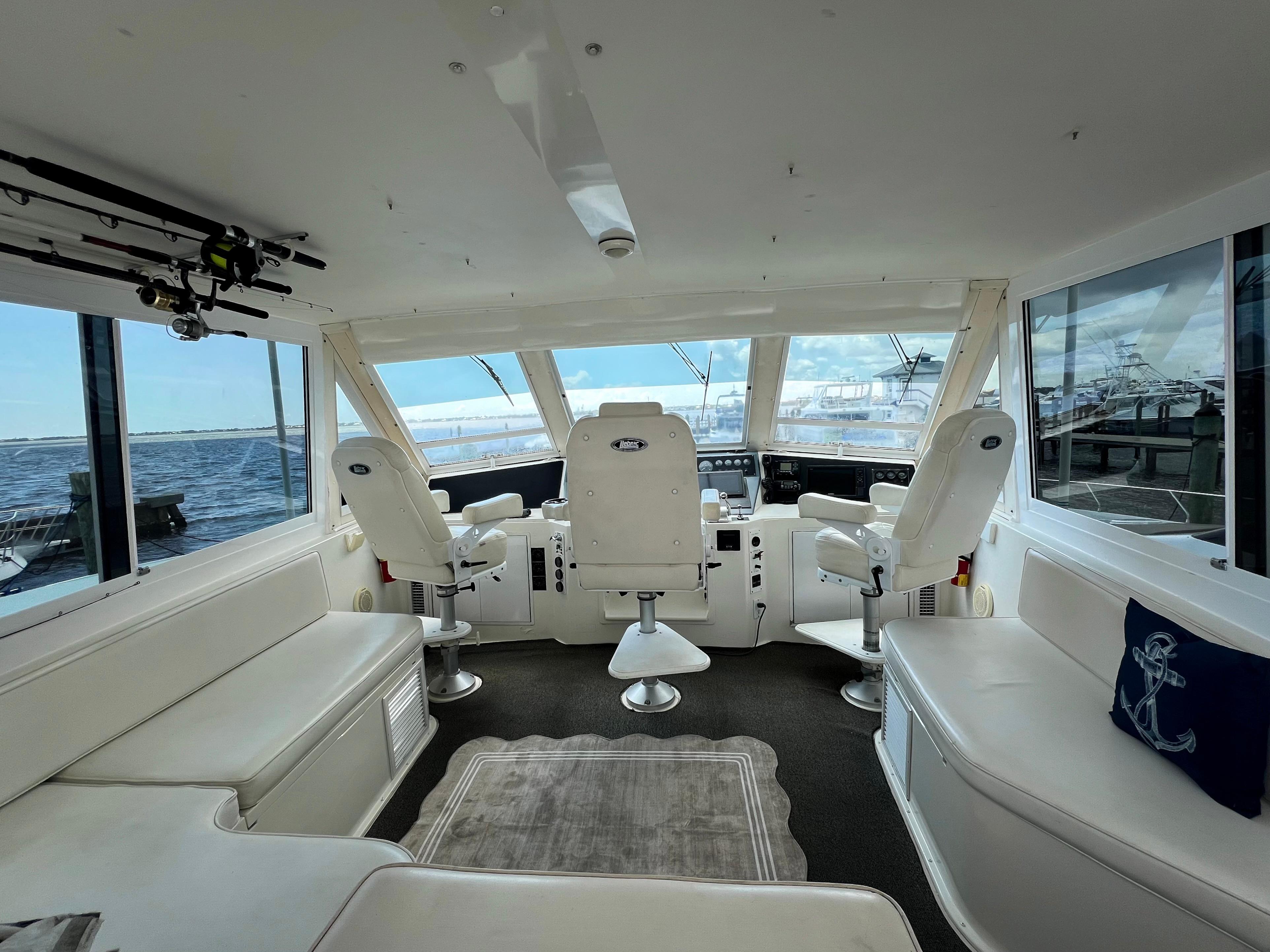 Viking-60 Cockpit Sport Yacht 1996-Sea Tiger FL-US-Interior of 1996 Viking 60 Cockpit Sport Yacht with white seating and ocean view.-9787053 | Thumbnail