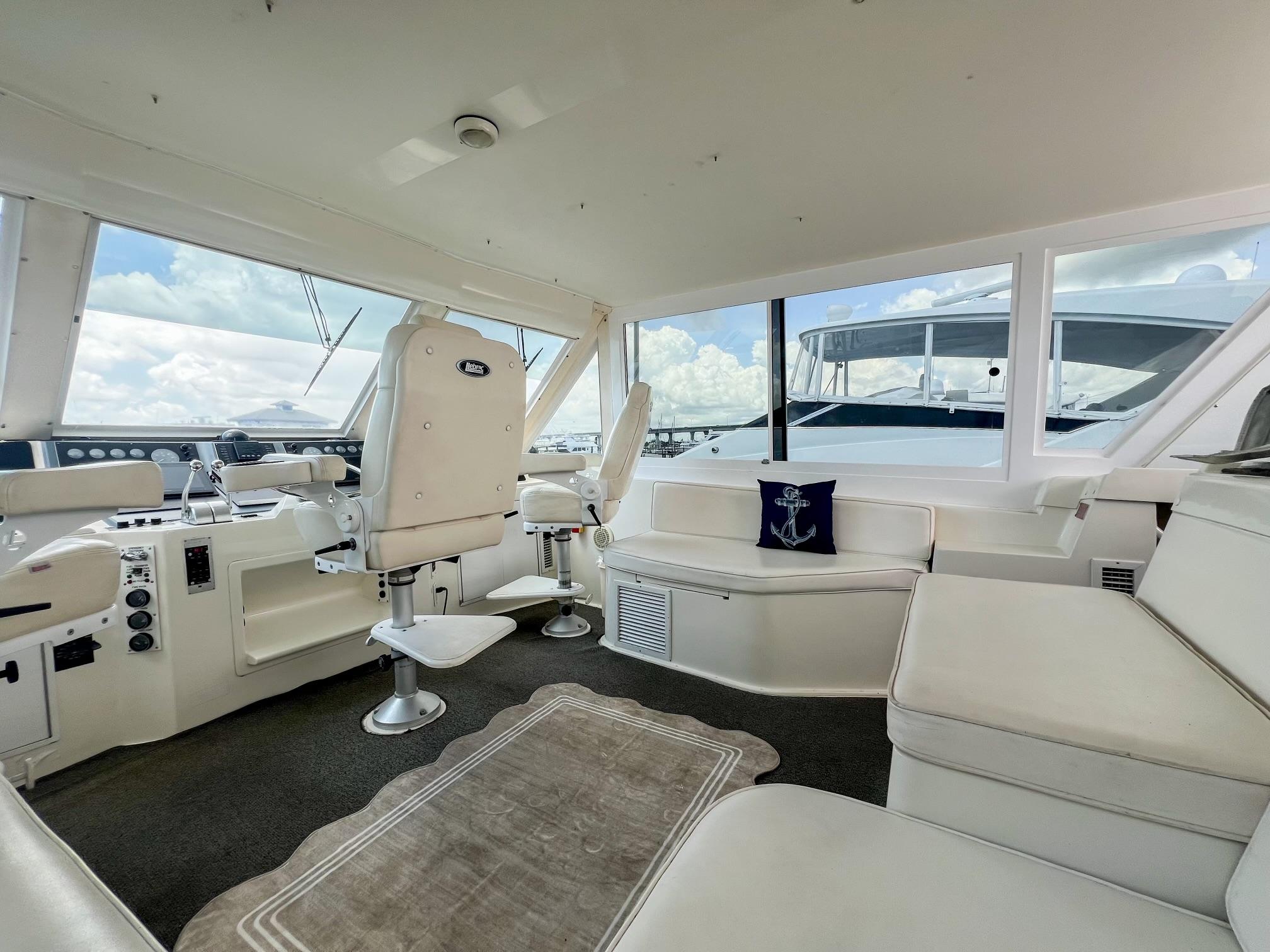 Viking-60 Cockpit Sport Yacht 1996-Sea Tiger FL-US-1996 Viking 60 Cockpit Sport Yacht interior with white seating and helm, featuring panoramic windows.-9787053 | Thumbnail