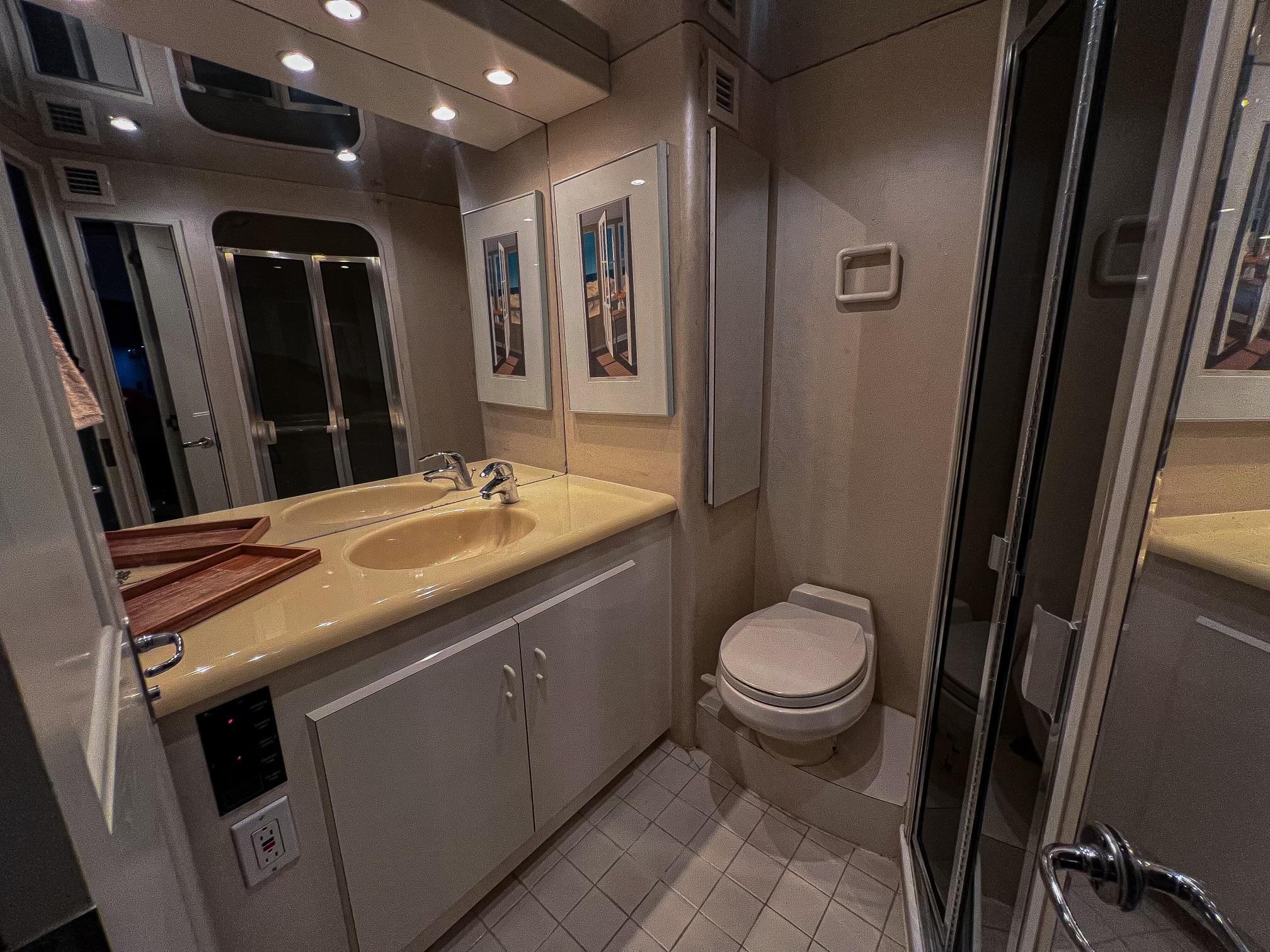 Viking-60 Cockpit Sport Yacht 1996-Sea Tiger FL-US-Luxurious bathroom in 1996 Viking 60 Cockpit Sport Yacht with modern fixtures and elegant decor.-9787053 | Thumbnail