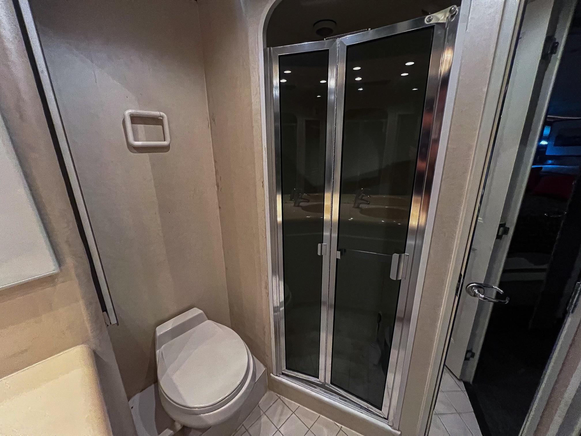Viking-60 Cockpit Sport Yacht 1996-Sea Tiger FL-US-Bathroom interior of 1996 Viking 60 Cockpit Sport Yacht with shower and toilet.-9787053 | Thumbnail