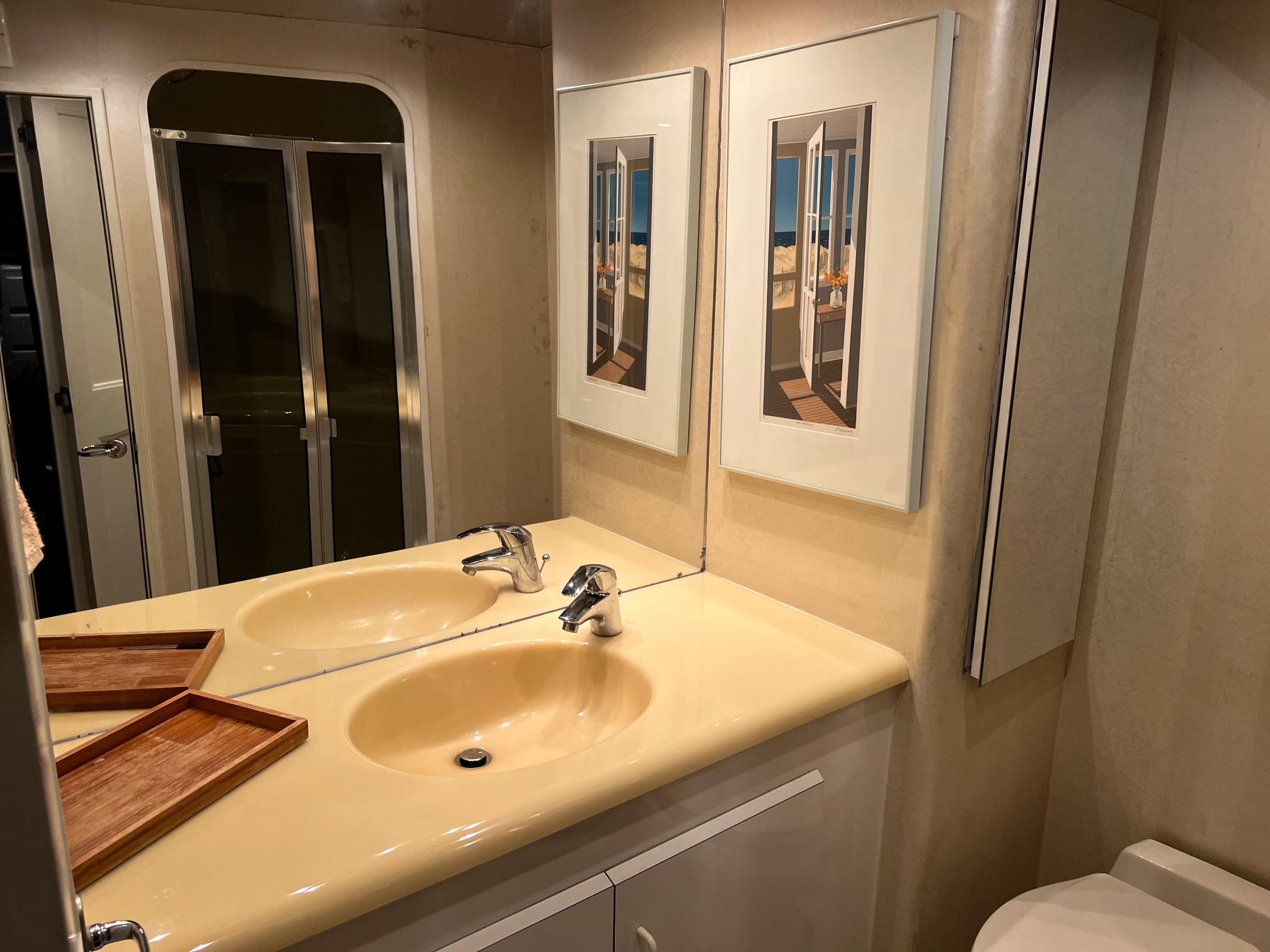 Viking-60 Cockpit Sport Yacht 1996-Sea Tiger FL-US-Bathroom interior of 1996 Viking 60 Cockpit Sport Yacht with dual sinks and framed artwork.-9787053 | Thumbnail