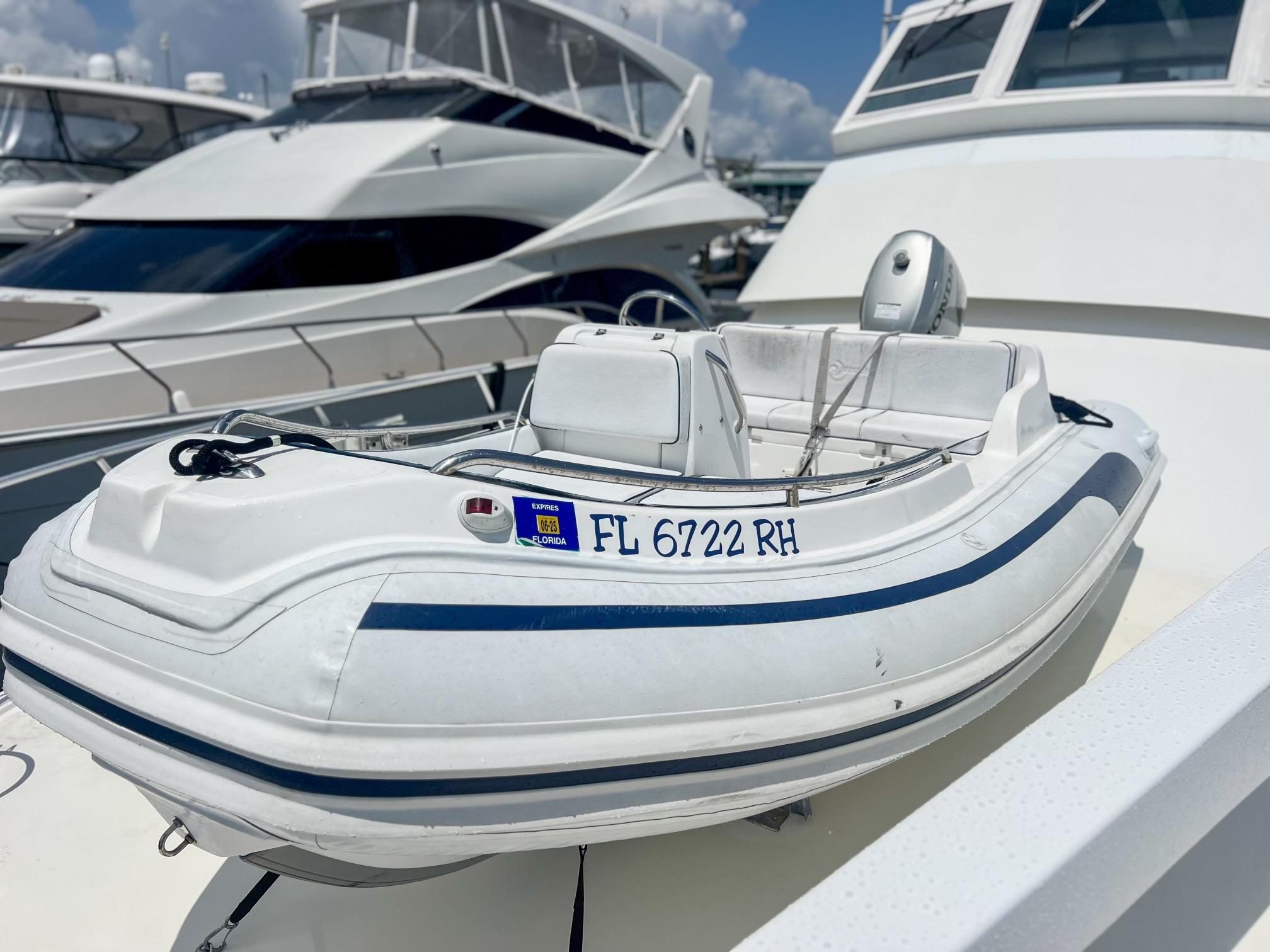 Viking-60 Cockpit Sport Yacht 1996-Sea Tiger FL-US-Inflatable boat on 1996 Viking 60 Cockpit Sport Yacht, docked with other yachts.-9787053 | Thumbnail