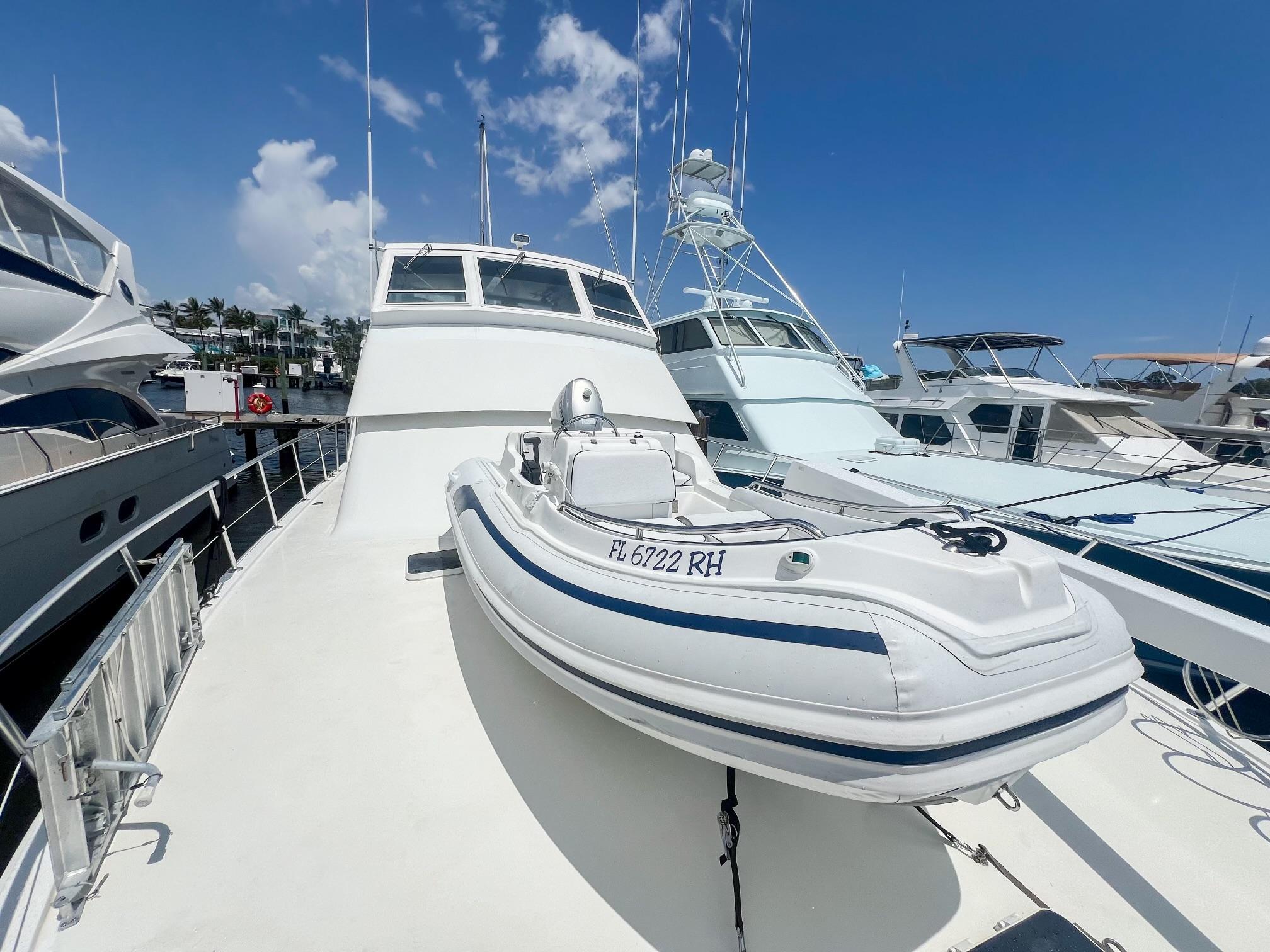 Viking-60 Cockpit Sport Yacht 1996-Sea Tiger FL-US-1996 Viking 60 Cockpit Sport Yacht with inflatable boat on deck, docked under clear sky.-9787053 | Thumbnail