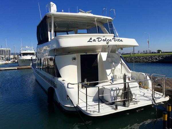 1999 Bluewater 5800 yacht named 'La Dolce Vita' docked in harbor.