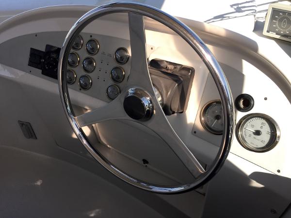 1999 Bluewater 5800 helm with gauges and steering wheel.