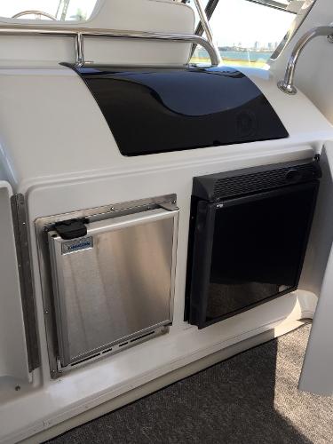 Interior of a 1999 Bluewater 5800 yacht with refrigerator.