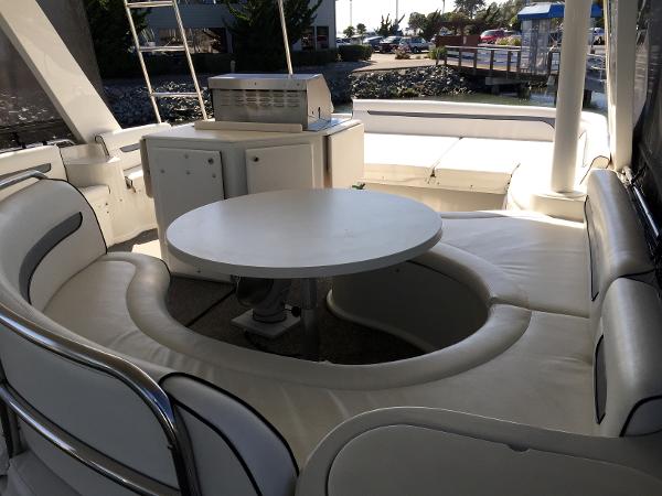 Interior of a 1999 Bluewater 5800 yacht with circular seating area.