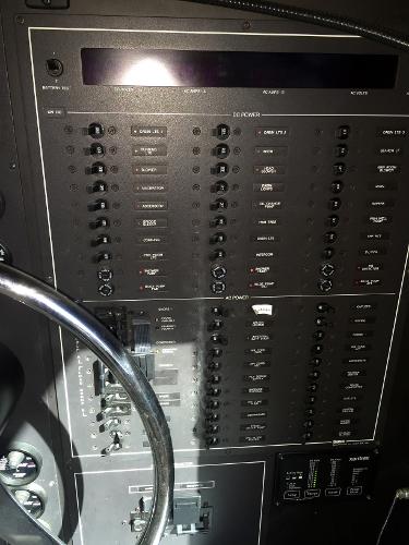 Control panel of a 1999 Bluewater 5800 with switches and indicators.