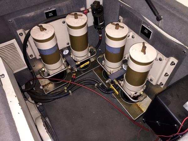 Engine room of a 1999 Bluewater 5800 with filters.