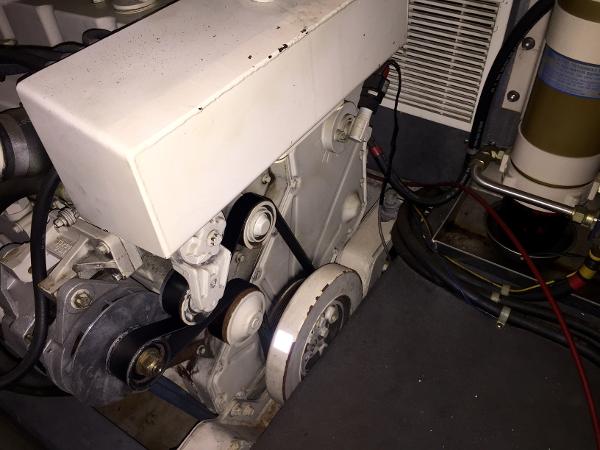 Engine room of a 1999 Bluewater 5800 with belt drive.