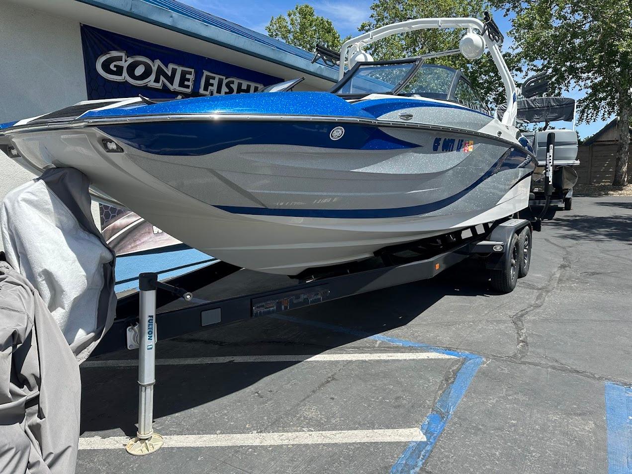 2021 Centurion Fi23 boat on trailer, parked outdoors, with 