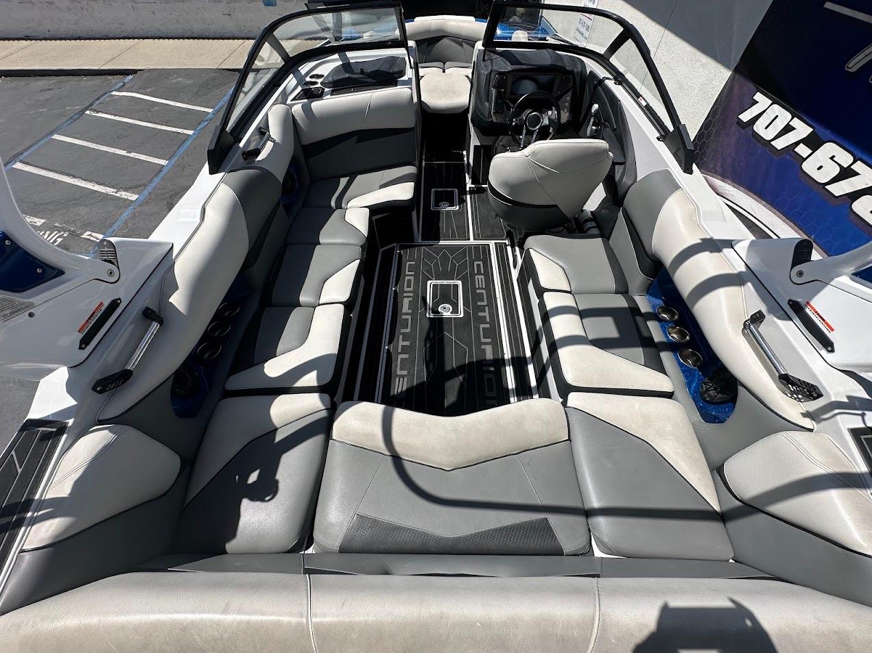 2021 Centurion Fi23 boat interior with gray seating and modern dashboard design.