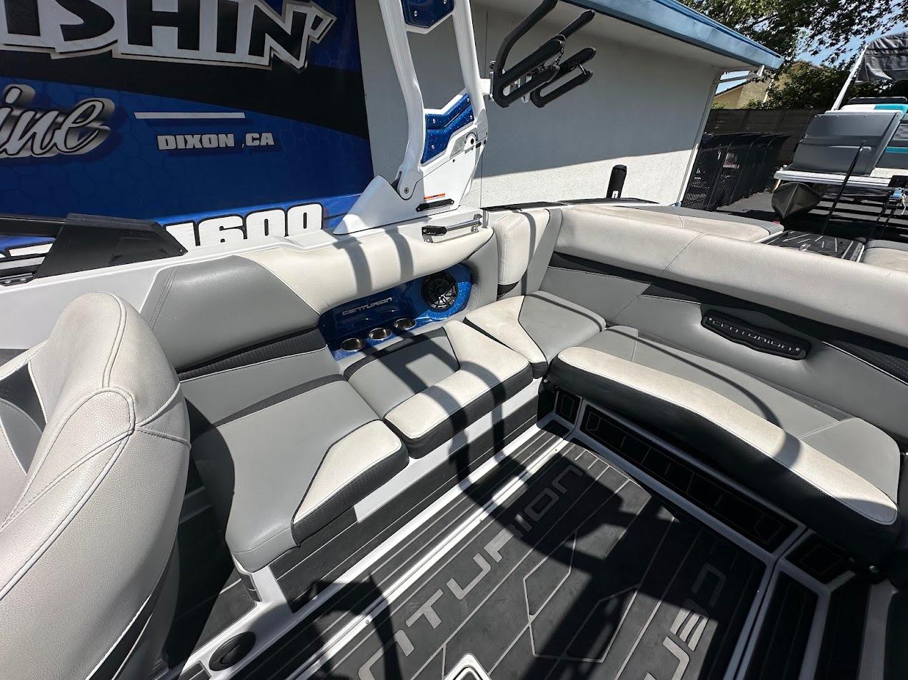 Interior of a 2021 Centurion Fi23 boat with gray seating and modern design.