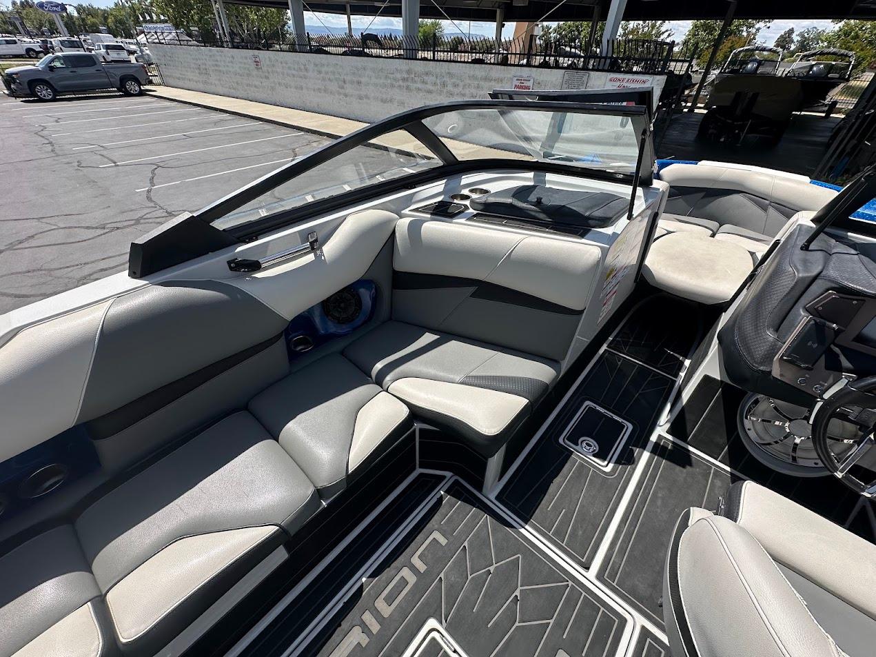 2021 Centurion Fi23 boat interior with gray seating and modern dashboard design.