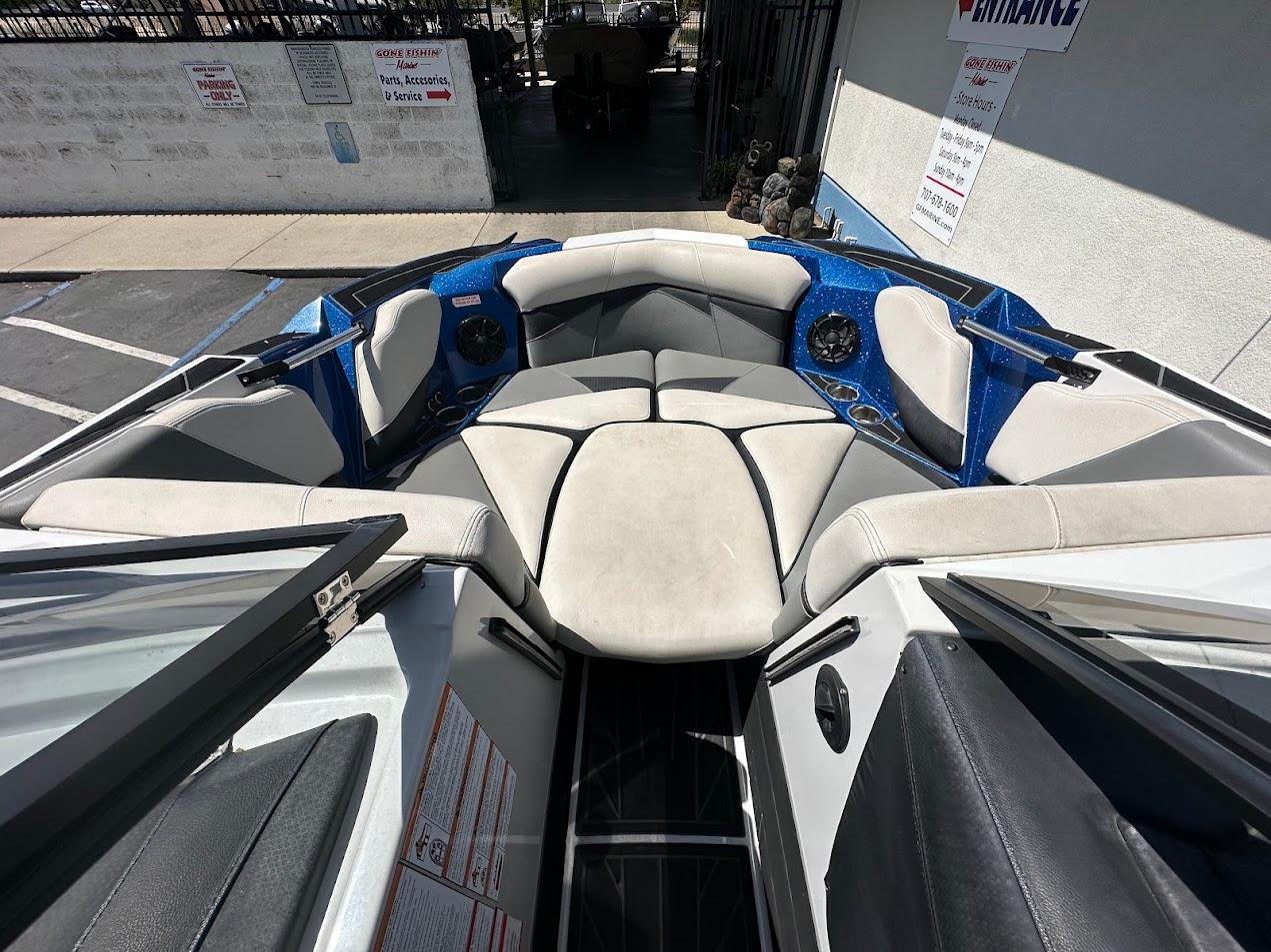 2021 Centurion Fi23 boat interior with cushioned seating and cup holders.