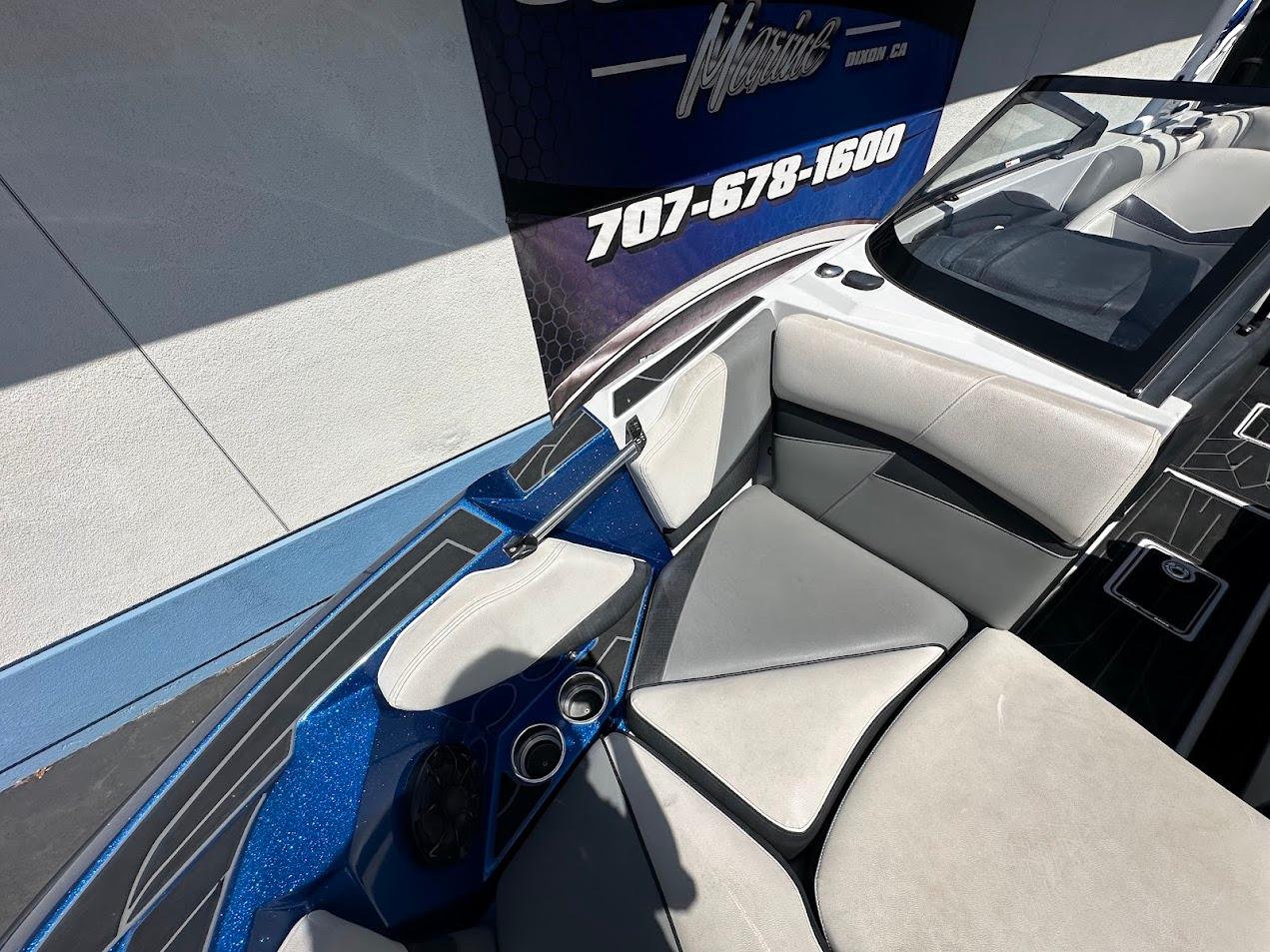 2021 Centurion Fi23 boat interior with blue accents and comfortable seating.