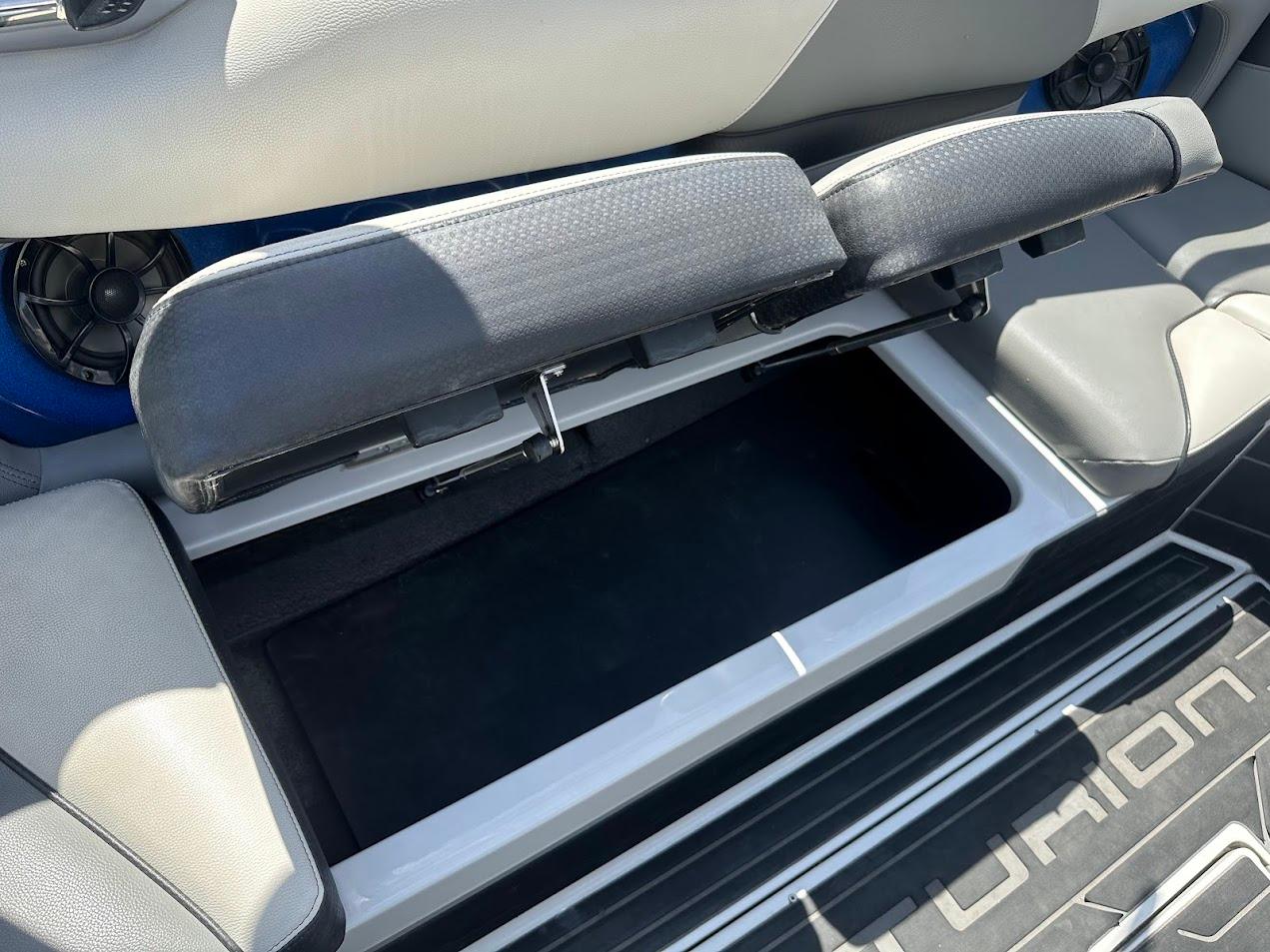 Open storage compartment in 2021 Centurion Fi23 boat interior.