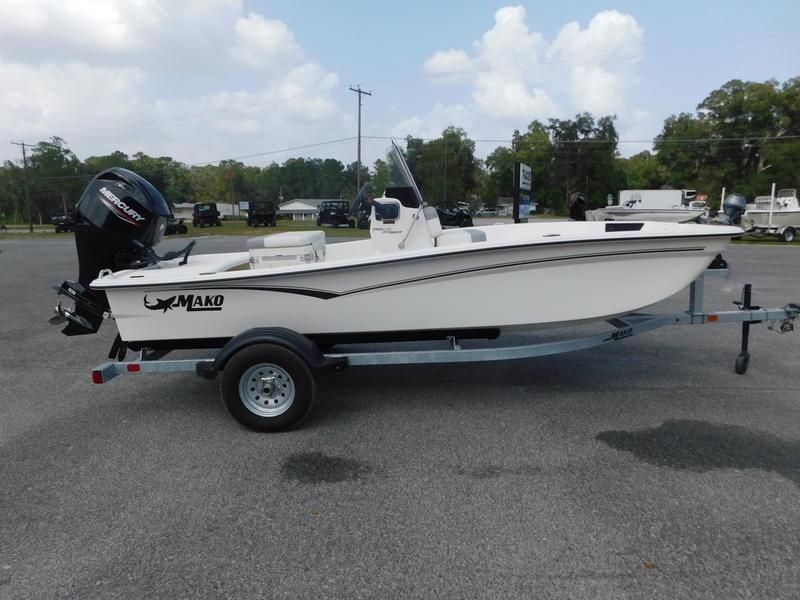 2023 Mako Pro Skiff 15 CC on trailer with outboard motor.