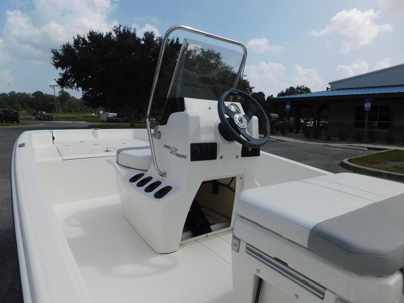 2023 Mako Pro Skiff 15 CC boat with center console and steering wheel.