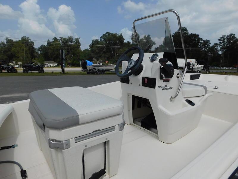 2023 Mako Pro Skiff 15 CC boat interior with console and seating.