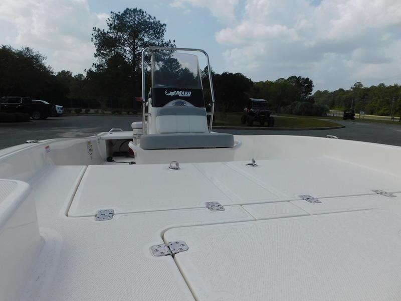 2023 Mako Pro Skiff 15 CC boat with center console in a parking lot.