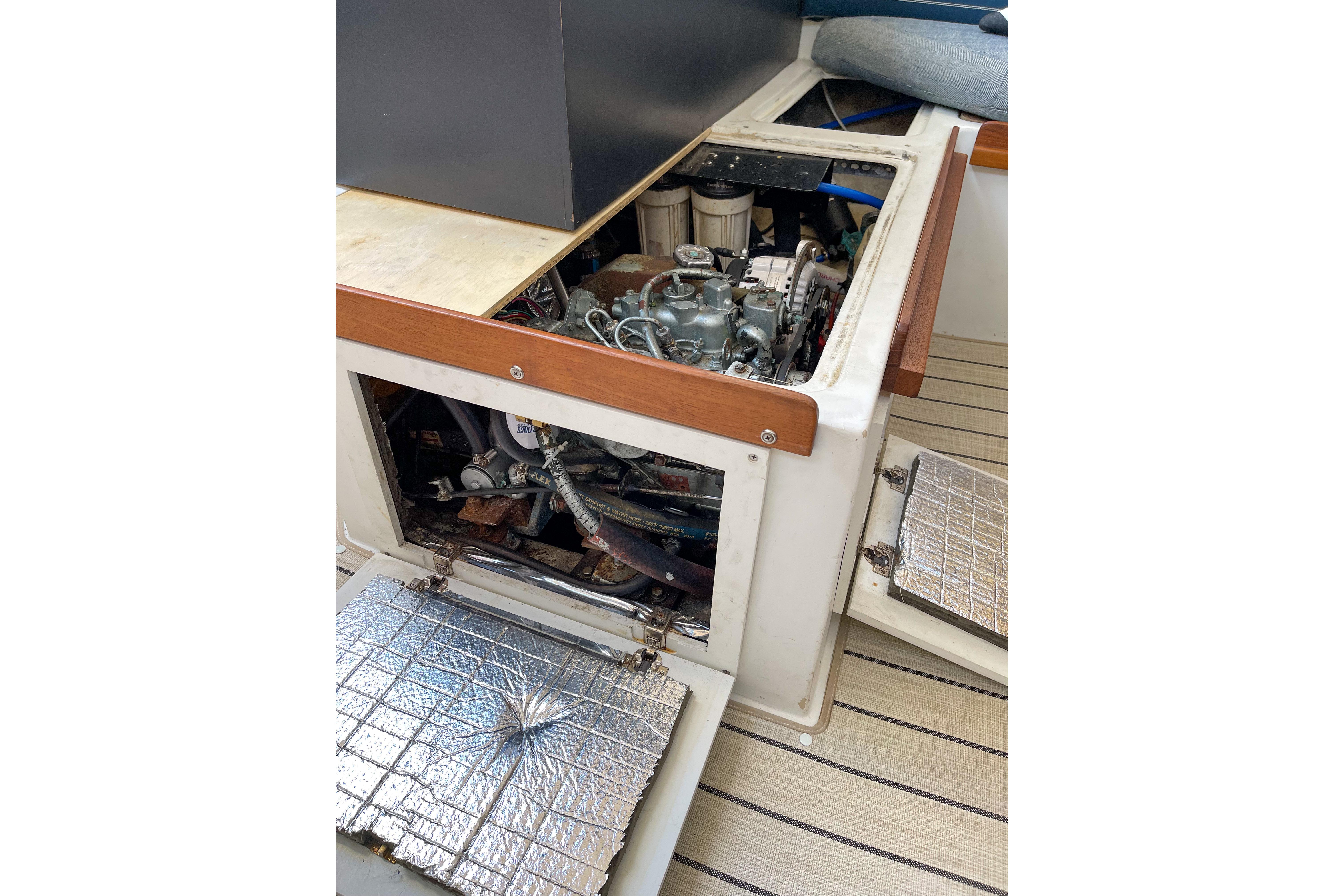 1981 Catalina 30 sailboat engine compartment with open access panels.