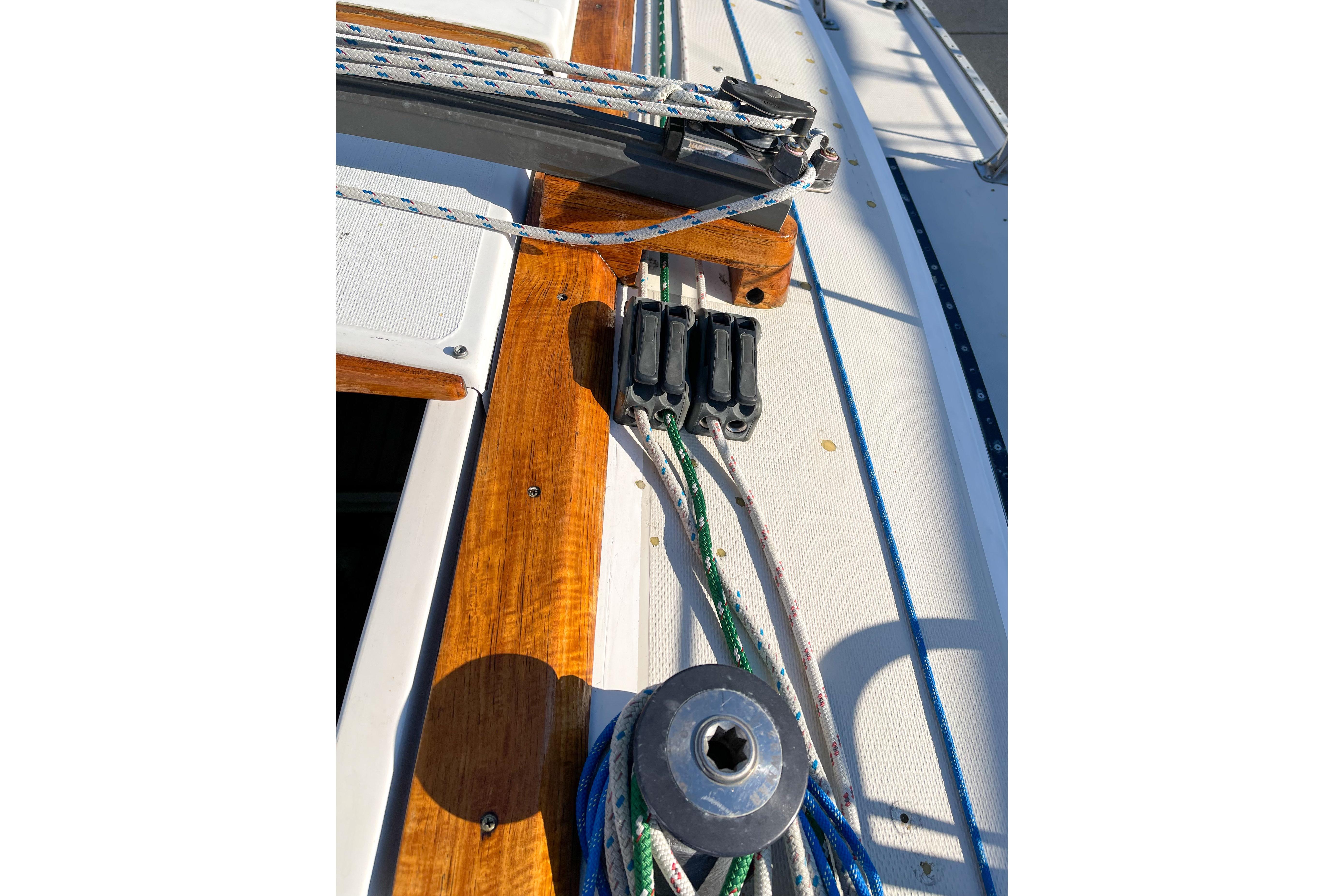 Close-up of 1981 Catalina 30 sailboat deck with ropes and winch.