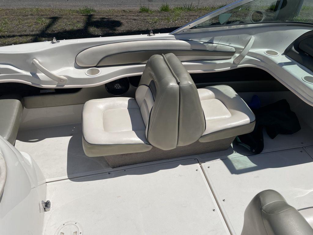 2004 Sea Ray 185 Sport boat interior with white and gray seating.
