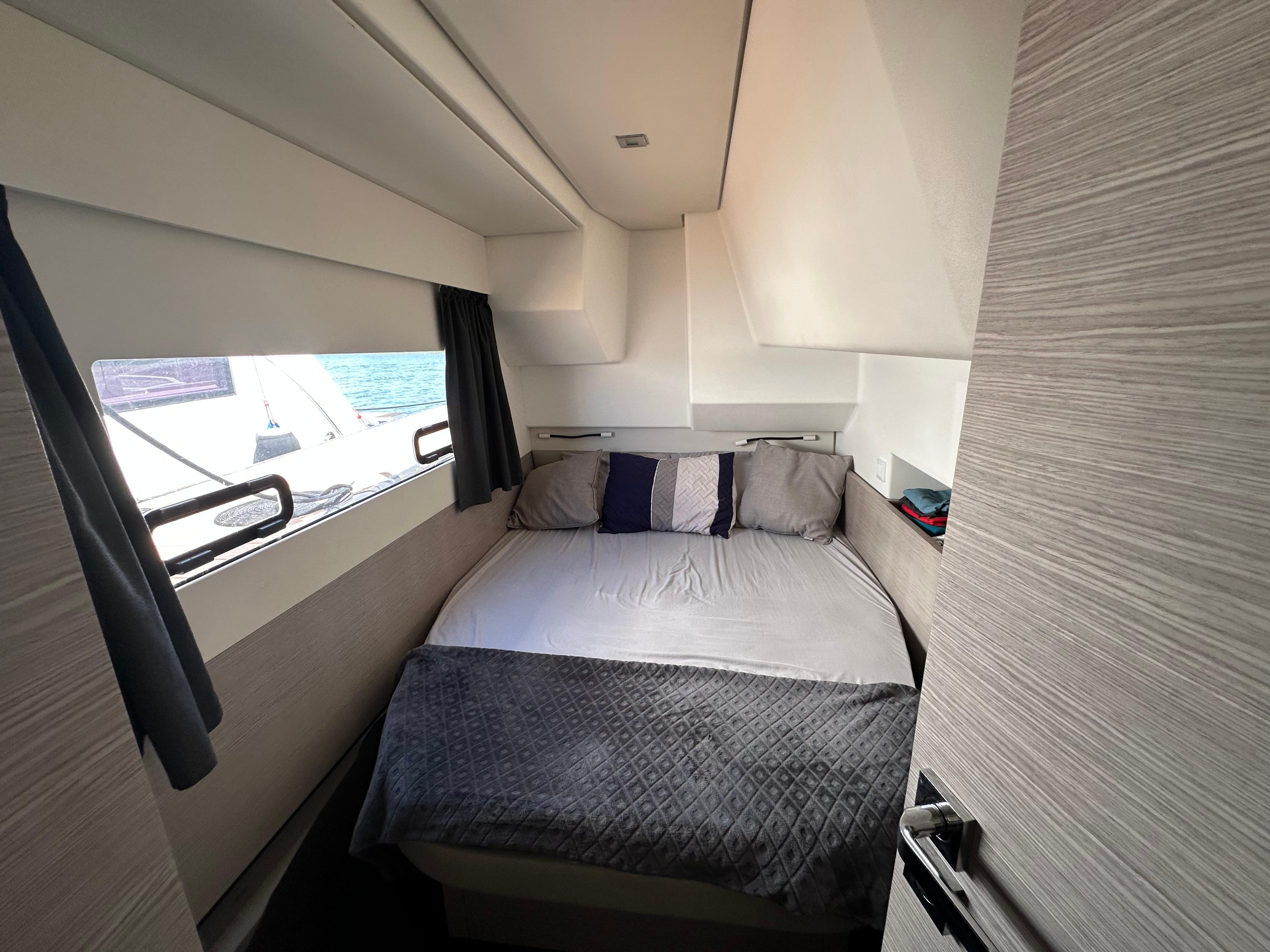 Fountaine Pajot-MY4.S 2021-Vie Pure SC-US-Cozy bedroom interior of 2021 Fountaine Pajot MY4.S yacht with ocean view.-9747125 | Thumbnail
