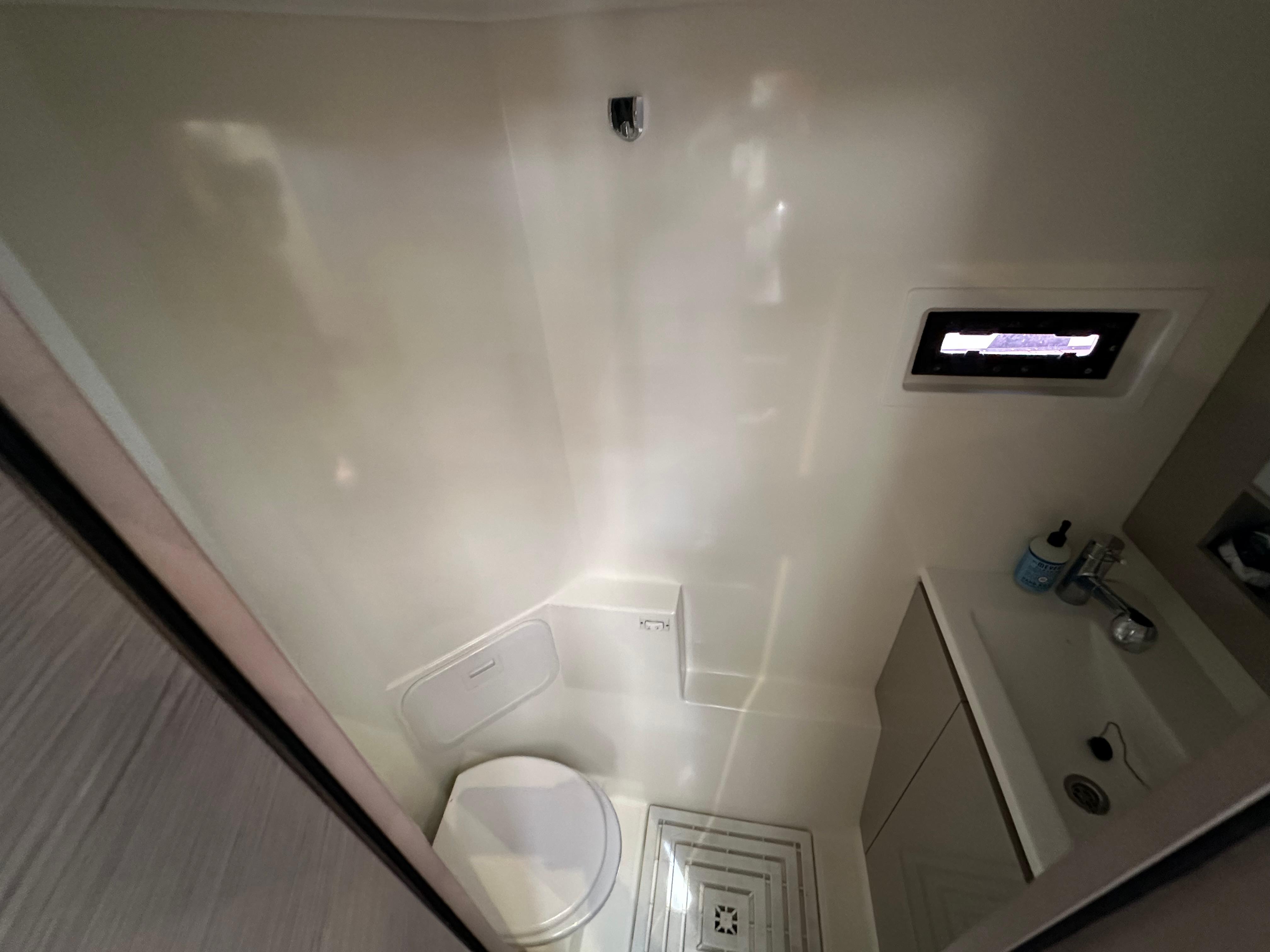 Fountaine Pajot-MY4.S 2021-Vie Pure SC-US-Compact bathroom in 2021 Fountaine Pajot MY4.S yacht, featuring toilet and sink.-9747125 | Thumbnail