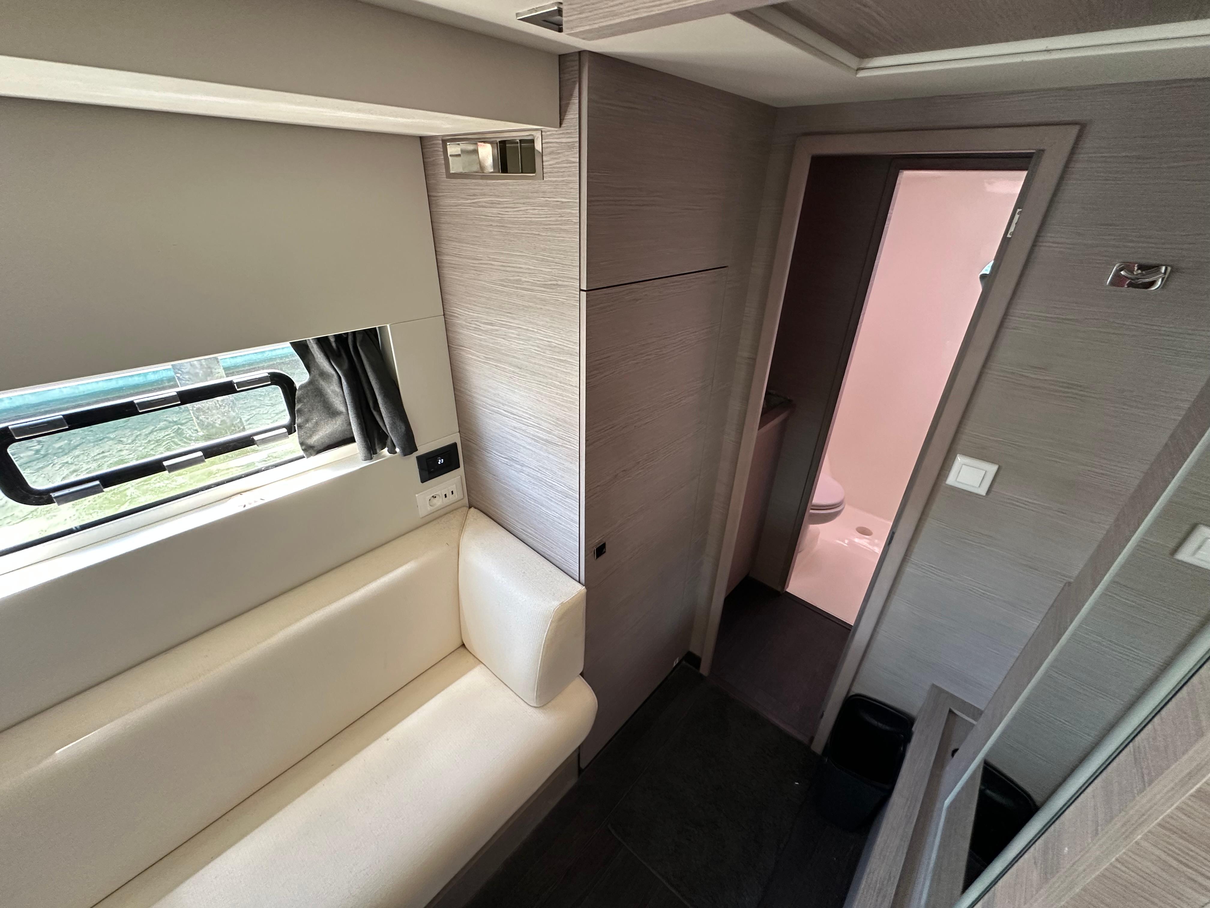 Fountaine Pajot-MY4.S 2021-Vie Pure SC-US-Interior of 2021 Fountaine Pajot MY4.S yacht, featuring modern seating and bathroom.-9747125 | Thumbnail