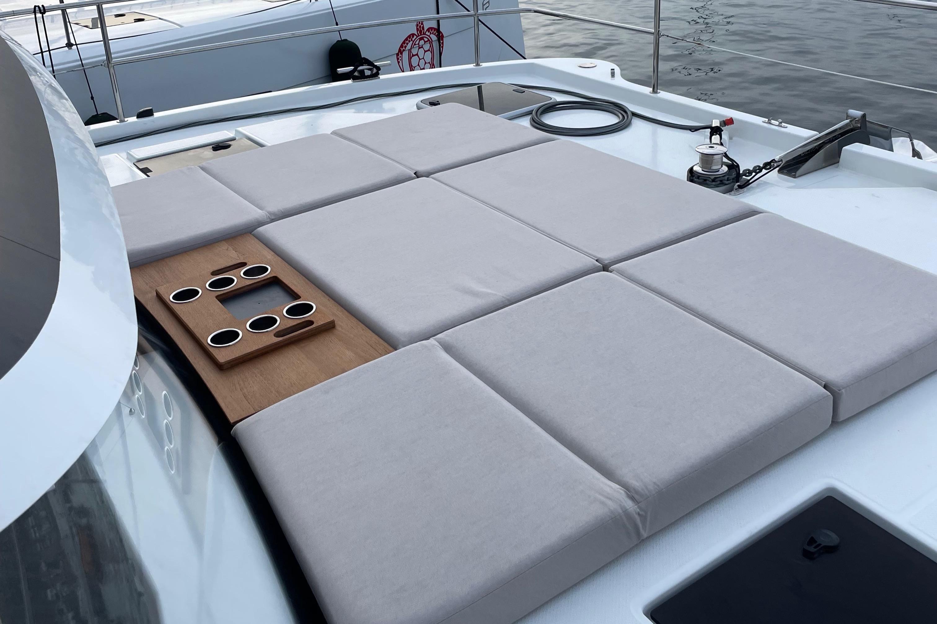 Fountaine Pajot-MY4.S 2021-Vie Pure SC-US-Sunbathing deck on 2021 Fountaine Pajot MY4.S yacht with cushioned seating and cup holders.-9747125 | Thumbnail