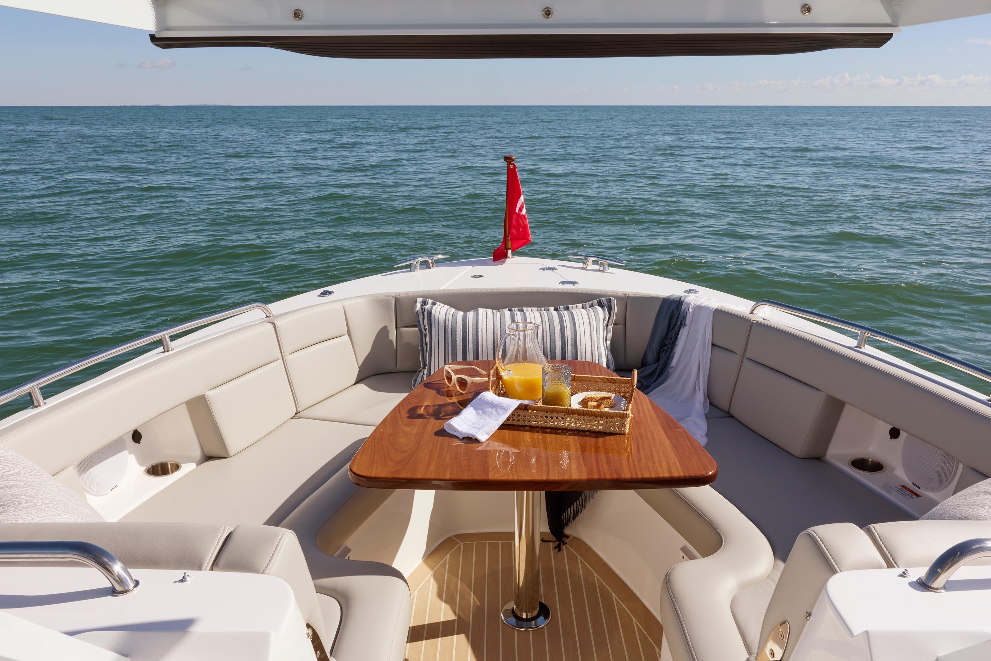 Luxurious 2026 MJM 38 X yacht with elegant seating and ocean view.