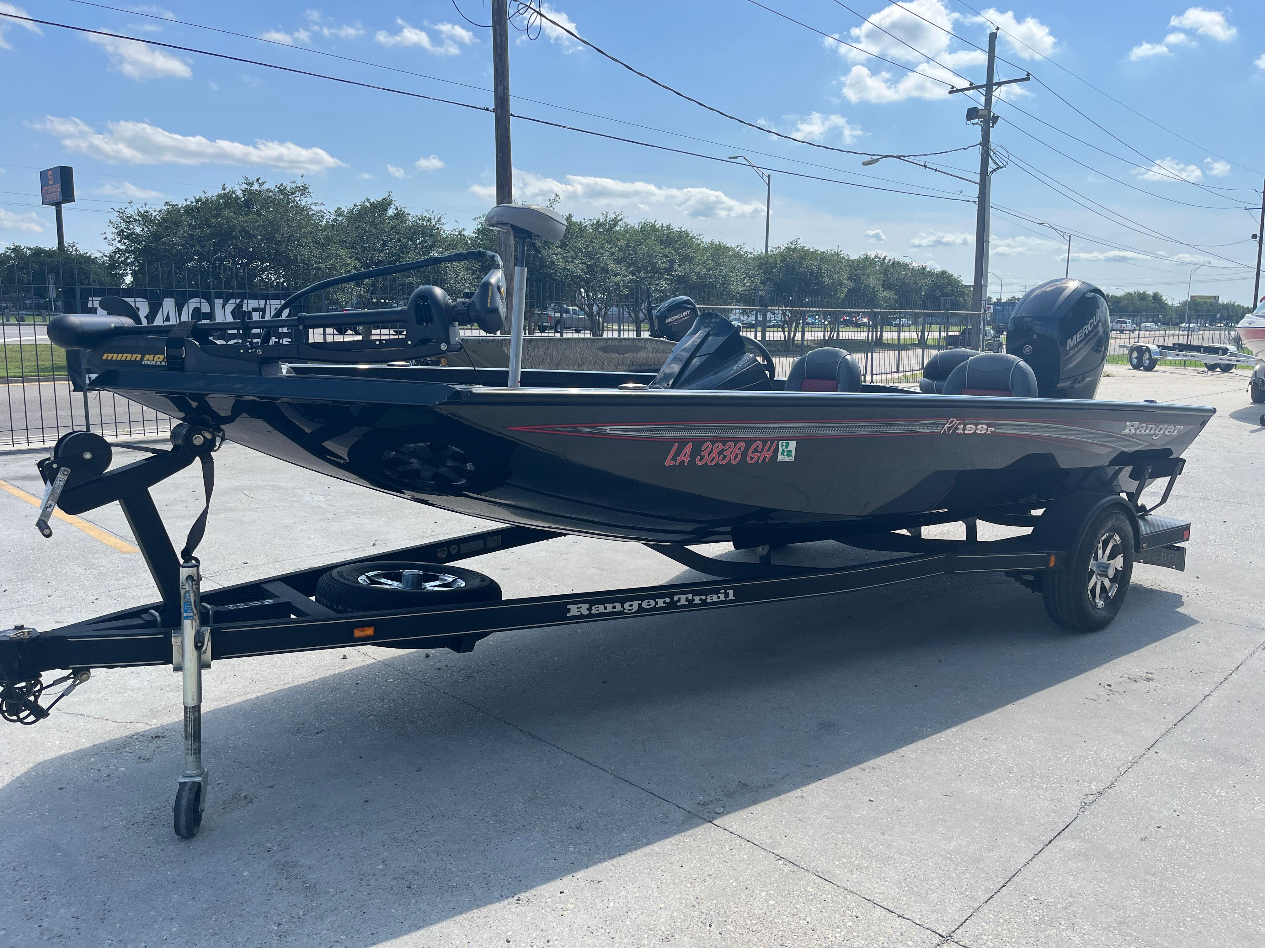 2017 Ranger RT 198P boat on trailer, parked outdoors under a clear sky.