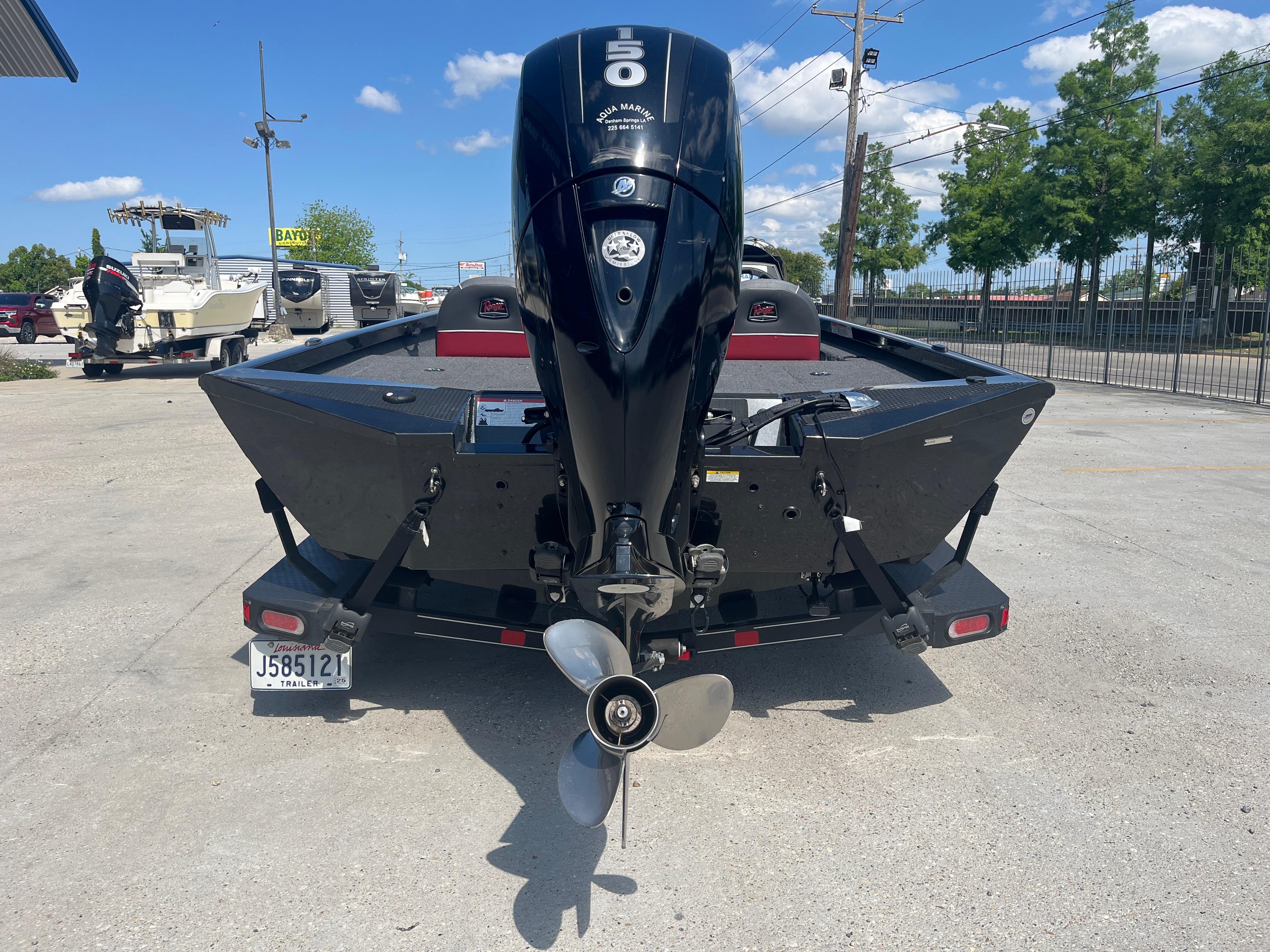 2017 Ranger RT 198P boat with outboard motor, parked outdoors on a sunny day.