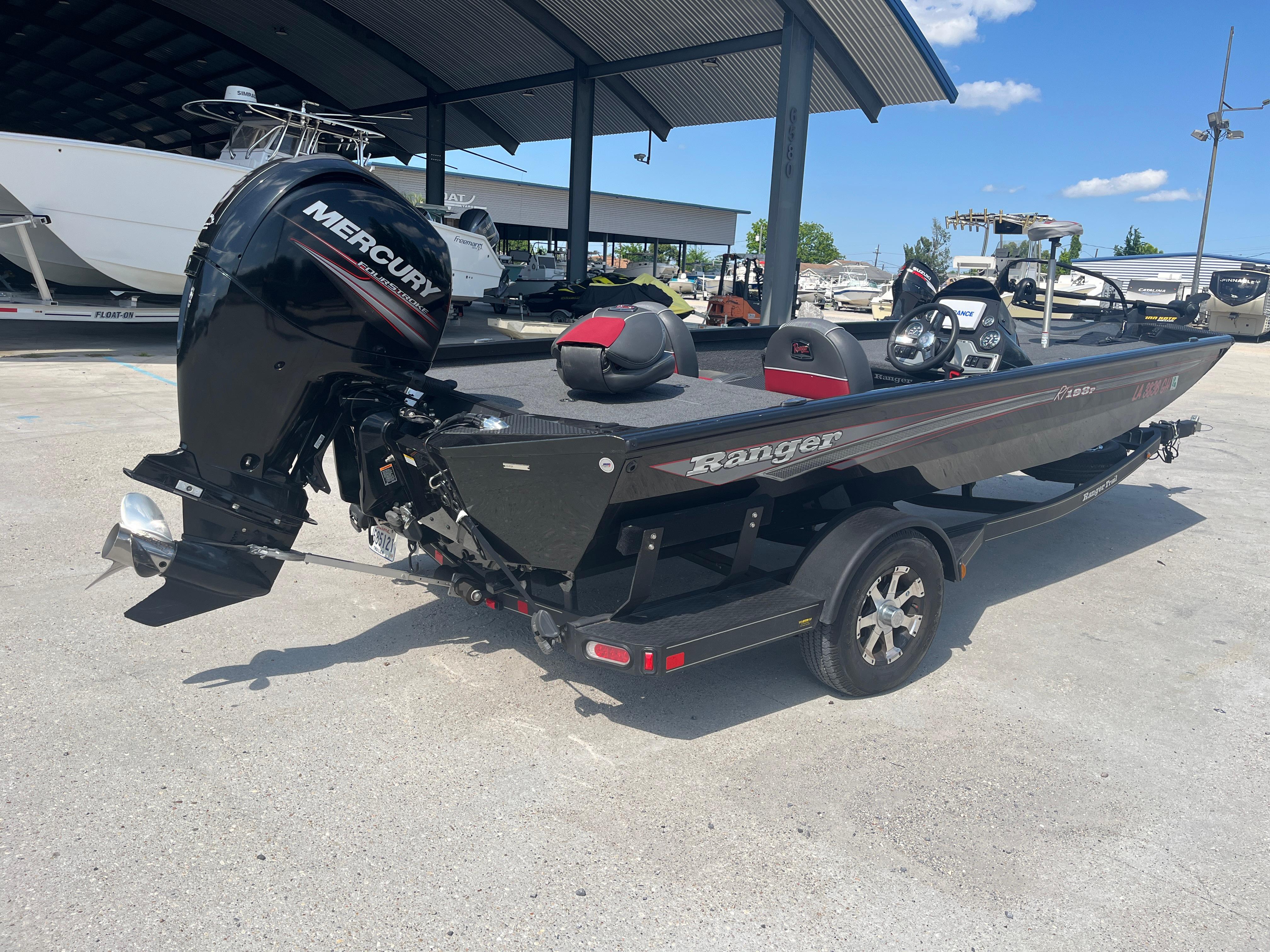 2017 Ranger RT 198P boat with Mercury engine on trailer, parked outdoors under clear sky.